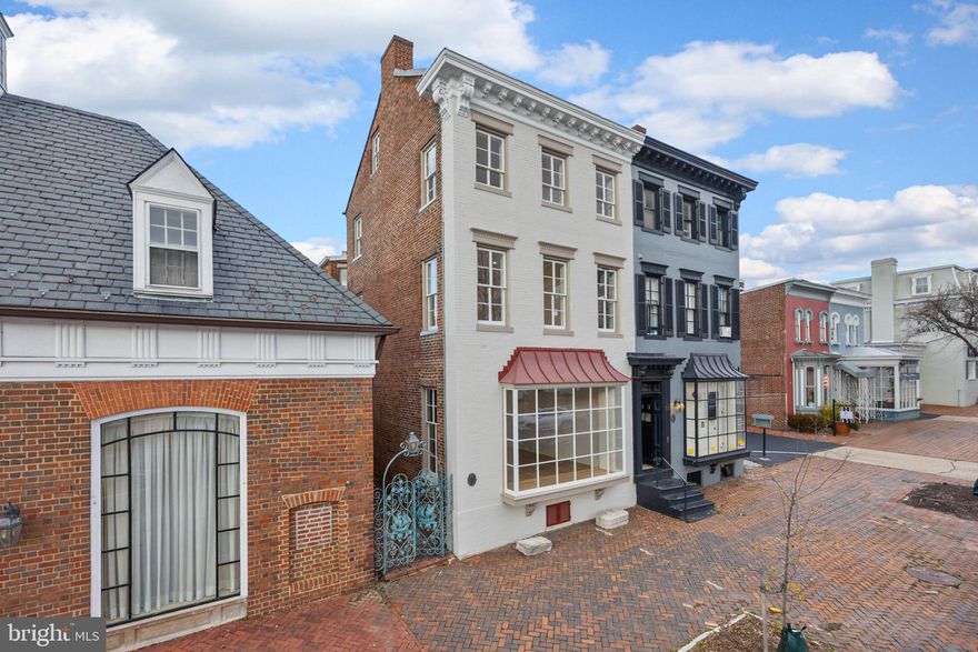 over 2100 finished square feet of main and lower level commercial or retail space plus TWO 1100 square ft 2 bedroom/2 full bath apartments/airbnb/vrbos plus TWO parking spaces!!  Seller has spared no expense remodeling and updating this building with almost $1 million in recent improvements.   Over 4200 total square feet.  Recent improvements include painting, new flooring, new doors, plumbing, electrical, heaved up electrical services allowing each unit to be separately metered, interior sprinkler system installed & larger water service installed to accommodate sprinkler system.  Rear roof replaced, 5 new bathrooms, 2 new kitchens and appliances, washer/dryers in each apartment.  New rear staircase made of steel, 2 new hot water heaters for each apartment, installed fire rate ceiling system between commercial and residential spaces consisting of double layered 5/8'' fire rated drywall separated by metal hat channel.  Preventative sump pump installed in lower level.  Most windows replaced and historic windows on front were reworked and weather stripped.  All new interior doors and millwork except where owner was able to salvage in the front.  Spray foam insulation between floors for noise reduction. Access the 2 apartments from the rear of the building, not entering or disturbing main floor commercial space.  Top floor apartment has pull down attic with tons of storage.  Buy the whole building, run your business out of the main and lower floor and then rent the 2 residential units for immediate cash flow.