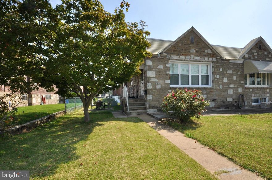 Welcome to this 3 bedroom, 1.5 bathroom stonefront twin raised rancher.  As you enter the main entrance you will notice how open the floor plan is and the large living room.  The living room features wall to wall carpeting and a ceiling fan with light.  From there step into the dining room with chair height natural wood wainscoting walls and custom coffered styled ceiling with new light fixture.  The dining room  is conveniently next to the updated kitchen which features plenty of solid wood cabinets and lots  of counter space along with the coffered style ceiling and newer light fixture.  As you make your way down the hall you will find a large coat closet and additional linen closet.  The first bedroom will be on your left and features hardwood flooring and a ceiling fan with light fixture.  The main bedroom is a very good size and features wall to wall carpeting, a ceiling fan with light and large closet with sliding mirrored doors.  The 3rd bedroom features newer laminate flooring, a ceiling fan with light and access to the large rear deck.  This room is ideal for a home office as well.  The lower level is a huge open room with carpeting, a powder room, a large laundry area and access to the converted garage room.  This room could easily be turned into a 4th bedroom or home office with a separate entrance.  There is access to the rear driveway for 2 or 3 car parking as well.  The property has all newer vinyl replacement windows throughout.  Come take a tour before it's gone!