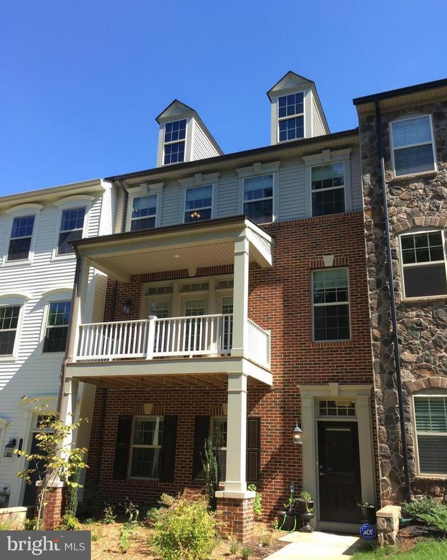 Spectacular townhouse w/ 2 car garage in desirable Cascades community. New Paint Allover. New Luxury Vinyl Plank on Top and bottom Levels. Energy Star Certified Home. Huge east facing deck off kitchen with miles of beautiful view and deck off family room looking out at treed common area. Hardwood Floor on whole 2nd level. Kitchen has upgraded cabinets, stainless steel appliances, and granite counters. Upgraded baths.  Premium lot. Plenty of parkings.