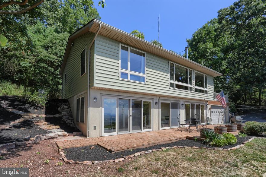 On-Site Public Auction Wednesday, May 13, 2026 @ 5 PM. DO NOT do a drive-by! This an occupied Airbnb. Open House Saturday, May 2, from 10 am-3 PM and 2 Hours prior to the auction. This is an active Airbnb. DO NOT attempt a drive-by or private showing! Buyer required a 10% non-refundable deposit. Settlement within 45 days. Buyer pays the 2% RE Transfer Tax. List price does not reflect the final sales price. **Blue Mountain Overlook is an Operating Airbnb designed for couples. Situated on a 2.1 Acre Mountain Lot that comes with a million-dollar view! The 2 Bedroom Chalet is nestled on the Blue Mountain in the Appalachian Trail Area and features an outstanding open floor plan with Kitchen, Family Room, Primary BR & Bath, plus a Full Finished Walkout Basement equipped with a Home Gym, Full Bath, and a Stellar View! Outdoor features include a large deck with a covered hot tub, gas fire pit, and sitting area. This Exceptional Property has many efficiencies, including geothermal heat & CA, EV Charging Station. Don't miss out on this unique opportunity to purchase a very successful Airbnb, just minutes from 1-78.