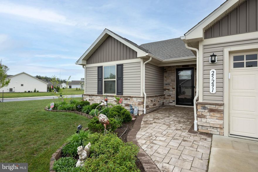 Introducing 25291 Tannin Circle located in the prestigious coastal community of The Vines at Sandhill. This 3bd/2ba home is truly one of a kind. This home has been meticulously cared for and pride of ownership shows throughout. The seller has spent an additional $177,5000 in renovations creating a home that is worthy  enough to be on the cover of a magazine!  Let's review the home. The kitchen is fully upgraded to include stainless appliances, high cabinetry highlighted by crown molding. island bar, upgraded lighting, ceramic tiled back splash, pantry, remote electric window treatments... The owner created additional storage space by adding another set of cabinets, glass face, granite counters and a wine cooler. The flow of the open floor plan allows for excellent entertainment opportunities. Custom ceiling fans and lighting throughout the home. Upgraded bathrooms and a laundry room boasting  state of the art LG washer and dryer. The home features two paver patios. The 1st patio is the hub and contains a custom built in BBQ grill with stainless underneath storage, pizza over, fire pit, water fountain, seating and ample  fixed lighting. The 2nd paver patio is directly adjacent to the master patio, easily accommodating larger social gatherings. The upgraded four season sunroom features sliding doors, eight casement sliding windows, ceiling fan and a bonus heated floor for those cold winter days. All of the walk in closets are upgraded with custom shelving in the bathrooms and the the 3rd bedroom. All of the home's interior & exterior lighting have been totally upgraded. There's a very active HOA that offers all sorts of events. The featured community amenities include a large inground pool that offers the best of summer enjoyment. Enjoy activities at the clubhouse or exercise in the fitness center. Play a little tennis or enjoy a happy hour around the community fire pit. Let's not forget the tot lot for the little ones and the dog park for all of our furry friends! Located in the highly desired Cape Henlopen School district. This home is being offer fully tastefully furnished (with some exclusions). For the buyer who wants it all, this home is absolutely spectacular. 

LIST OF UPGRADES TOTALING approximately $177,500
OUTSIDE
1) front walkway pavers 2) driveway sides trimmed with pavers, 3) extended gardens with brick borders from side to back 4) backyard patio pavers with brick bench, pizza oven, BBQ grill, water fountain, fire pit and electrical lights at the back & side pavers along with a trash can enclosure. Fire pit and pizza oven never used.
 Four season sunroom with outside lights, heated floors in the sunroom . 
DOORS, 
1) Two bi-fold doors 2) Master bedroom closet upgraded doors, 3) added doors to the flex room (3rd bedroom)  4. added storm door. 
LIGHTING
1) upgraded four hallway lights 2) upgraded master bedroom closet light 3) four ceiling fans- 3 bedrooms & sunroom 4) upgraded lights in kitchen. Lights added with dimmers - living room ceiling fan, dining room light, & two lights over the kitchen island table. Separate lighting in 2nd bathroom - two additional switches. 
KITCHEN
1)  kitchen cabinets extended top and bottom. 2) Ceramic tiled backsplash, granite counters , additional cabinetry, glass doors. base with granite & wine cooler. crown molding on all cabinetry. 
CLOSET VENDOR
1) owner suite closet. 2) 2nd bedroom. 3) 3rd bedroom built a closet. 4.)coat closet. 5) pantry 6) cabinets in washroom. 7) entertainment center 
WINDOW TREATMENTS
1) owners suite. 2) owner suite bathroom. 3) 2nd bedroom one blind. 4.)3rd bedroom one blind. 5.)living room two remote (electric) blinds. 6) living room one remote blind (sliding door). 7) kitchen one remote blind. All blinds are cordless costs 
BATHROOMS
additional cabinetry in both bathrooms
stainless steel front loading washer and dryer with a mini portable and a dryer with storage pedestal