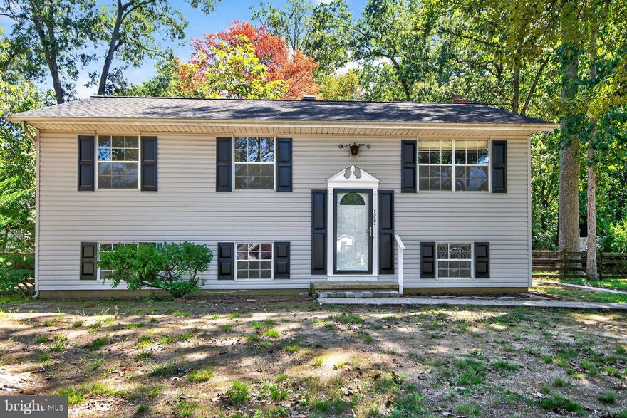 Holiday Special - New Price!  Seller is offering $5,000.00 toward closing cost to the buyer!
Seller has had the Wood Floors on the upper level and stairs refinished and new luxury vinyl planks on the lower family room level and hallway.  

Discover the potential in this 4-bedroom home set on a generous 0.44-acre lot in a wonderful Patuxent Manor community with no HOA! Offering nearly 1,800 sq. ft. of living space, this home has been freshly painted inside, with new light plates, updated electrical plates, and new light fixtures in the foyer and dining area for a refreshed look.

The upper level features refinished hardwood floors, three bedrooms, and a hallway bathroom updated with new flooring and a modern light fixture. The dining area opens to a screened-in deck, perfect for outdoor dining and relaxing.

On the lower level, enjoy a spacious family room with a cozy brick wood-burning fireplace, new luxury vinyl plank flooring, an additional large bedroom, full bathroom with new sink, utility room with  brand new washer, and plenty of storage. The exterior boasts freshly painted shutters and front door with a new storm door installed.

Community is also referred to as Riverwood, residents can take advantage of the nearby baseball field, tennis courts, playground, and pavilion—all maintained by the County. 

With its solid layout, large lot,  this home is ready for your finishing touches—don’t miss the opportunity to make it your own!