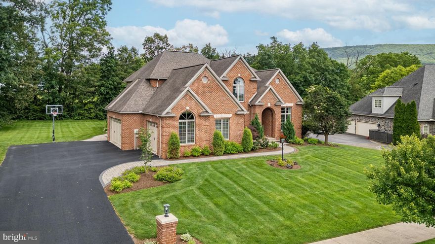 This stunning Stearns Crossing residence has been meticulously maintained and thoughtfully updated, ready to impress even the most discerning buyer!  Step into the elegant two-story foyer and you'll immediately notice the attention to detail. To the right, a beautifully appointed study awaits, complete with custom built-in cabinetry, crown molding, and glass-pane French doors. On the left, a formal dining room sets the stage for memorable meals, featuring intricate hardwood inlay floors, a tray ceiling, and classic wainscoting. The heart of the home is a chef's dream kitchen, outfitted with stainless steel appliances, gas cooking, rich cherry cabinetry, a stylish tile backsplash, and a center island with built-in sink. Adjacent is a kitchen seating area and a warm and inviting family room.  The stunning living room with a coffered ceiling and gas fireplace, as well as a butler's pantry with a wet bar is the perfect spot for family time or entertaining guests. Take either of the dual staircases to the upper level, where you'll find two spacious bedrooms sharing a Jack-and-Jill bath, one of which includes a versatile bonus room. The luxurious primary suite boasts a double tray ceiling, custom window treatments, and a spa-like ensuite bath with dual vanities, a walk-in rain shower, and two generous walk-in closets. A fourth bedroom with its own ensuite completes the upstairs layout. Back downstairs, a fully finished lower level is designed for fun and relaxation, featuring a large rec room with kitchenette and bar seating, a cozy lounge area with stone accent wall, and a full bath, ideal for game days, movie nights, or casual gatherings.  A bilco door leads to the outside.  And the showstopper? The incredible backyard oasis. Enjoy year-round outdoor living under a roofed pavilion with a stone fireplace, mounted TV, built-in gas grill and storage cabinets, and a full bar area. Whether you're hosting a party, entertaining guests, or simply unwinding, this space is the ultimate escape. Also featured is a 3-car garage with one extra large bay, work sink and side access.  When a home is this spectacular, you'll never want to leave!