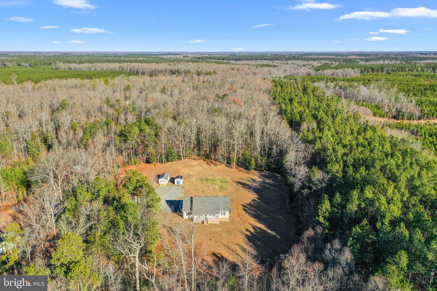 This immaculate 3-bedroom, 2.5-bath ranch-style home is situated on a peaceful 10-acre lot. Inside, you’ll find a spacious family room with vaulted ceilings, recessed lighting, a gas log fireplace, and built-in bookshelves with bottom cabinets. A sunroom opens up to the back deck, creating a great space for relaxing or entertaining. The kitchen features ample cabinet space and a bright dining area with a charming bay window. The laundry room includes generous storage with upper cabinetry. The primary bedroom offers a walk-in closet and a large ensuite bathroom with a jacuzzi tub, separate shower, large vanity with plenty of storage, and a linen closet. The home includes carpet in the bedrooms, hardwood in the main living areas, and tile flooring in the kitchen, laundry room and bathrooms. Enjoy the outdoors from the covered front porch or grill on the back deck with the convenient propane hookup. Additional features include a Rinnai tankless hot water heater and a huge attic for storage. The property also offers plenty of space to add a garage, pole barn, or additional structures to fit your needs. Septic, well, and WDI inspections have already been completed. This well-maintained home is ready for you to move in and enjoy peaceful country living with modern comforts. Only 10 minutes outside of town and 45 minutes to Mechanicsville.