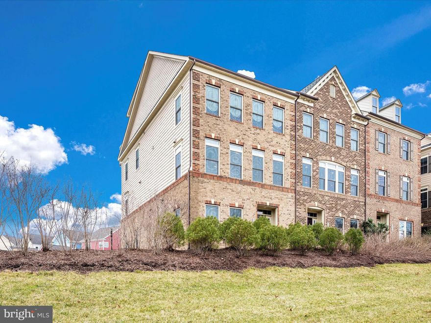 This Brick 2 car garage townhome combines luxury, a great lifestyle, and convenience. It's a sunny, move-in-ready home in the wonderful Urbana Villages. As you enter, you'll find a foyer that leads to an office/ den, exercise room, or can even be converted into an extra bedroom. There's a half bath on this main level that can be converted into a full bath if you so desire. It also has an additional space for storage. The main level is designed for entertaining and truly showcases the home's size and features. It has everything you could wish for—an impressive chef's kitchen with plenty of cabinets and storage for all your kitchen gadgets without overwhelming your pantry. The island is a true centerpiece, equipped with stainless steel appliances, a gas stove, a deep double sink, and a well-planned layout. The living room boasts three huge windows with transom windows above, creating a bright and inviting atmosphere. There's even a perfect coffee bar setup. It also has a half bath tucked in the corner. The dining room is spacious enough for your cabinet, buffet, and holiday table. The family area has double French doors that open onto your deck. Upstairs, you'll find two good-sized bedrooms for kids or guests that share an updated hall bathroom and a convenient laundry room. However, the star of this level is the primary bedroom! It's large enough for all your big furniture and even has space for a sitting area. There are two spacious walk-in closets, a tray ceiling, and a spa-like bathroom with a huge tiled shower and two built-in shower seats, complete with dual showerheads, for a truly relaxing experience. From here, head up to 1000 square feet of amazing space. It includes a walk-in closet, a beautiful full bathroom, and a French door leading to your rooftop terrace—a true sanctuary just waiting for you. This townhome is unbelievably close to major roads and shopping areas. Don't miss the chance to make it yours!