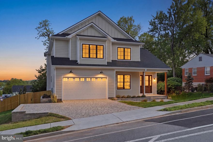 Experience luxury living at its finest in this spectacular new construction on Williamsburg Blvd in Arlington’s sought-after Berkshire Oakwood neighborhood. A spectacular Kane Home Design & Build product! From the grand foyer, you’ll immediately notice the soaring ceilings on all three levels, expansive black-frame windows that flood the home with natural light, and wide-plank white oak floors that set a warm, elevated tone throughout. Designed for both everyday comfort and unforgettable entertaining, the main level features an extraordinary open layout with a showstopping gourmet kitchen—complete with an oversized island with seating, premium stainless steel appliances, an expansive walk-in pantry, and a sunny breakfast nook with access to the rear deck. The adjacent family room offers a cozy gas fireplace, while the separate formal dining room with coffered ceilings is perfect for hosting. A versatile main-level office/bedroom includes a closet and ensuite full bath. You’ll also love the thoughtfully designed mudroom with built-ins, sink, and full-size laundry, offering dual access from the interior and the oversized two-car garage. Upstairs, retreat to an impressive primary suite with cathedral ceiling, sitting area, mini bar, and two walk-in closets. The spa-inspired bath is straight out of a magazine—double vanities, dual showers, and a soaking tub for the ultimate unwind. The secondary bedrooms are beautifully planned: two share a Jack-and-Jill bath, while another enjoys a private full bath. A second upper-level laundry room with cabinetry and counter space adds everyday ease. The walk-out lower level is an entertainer’s dream with a spacious recreation room, large wet bar, dedicated fitness area, and a sixth bedroom with full bath—ideal for guests. Step outside to a fenced backyard with pavers, perfect for relaxing or hosting. Commuters will appreciate easy access to I-66, and you’re also conveniently close to East Falls Church & Falls Church Metro, Falls Church City favorites (Farmer’s Market, Whole Foods, shops, and restaurants like Thompson Italian and Clare & Don’s), and just minutes to Tysons Corner. Zoned for Nottingham ES / Williamsburg MS / Yorktown HS.