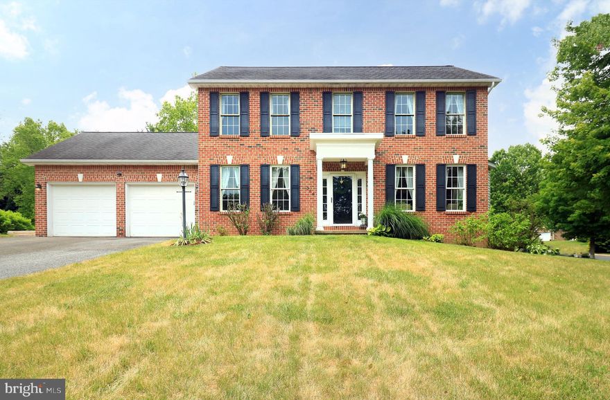 In Greenleaf Manor, 4 bedroom, 3.5 bath brick front colonial near bike path and park.  Two story home on corner lot with covered front entry, rear deck, family room with gas fireplace and hardwood floors throughout first floor and primary bedroom. Granite flooring in powder room. The kitchen features granite countertops and island, maple cabinets, 5 burner gas range/oven, stainless steel appliances and pantry. Finished lower level has a Rec Room, full bath with ceramic tile and pedestal sink. Laundry room has ceramic flooring and second stove.