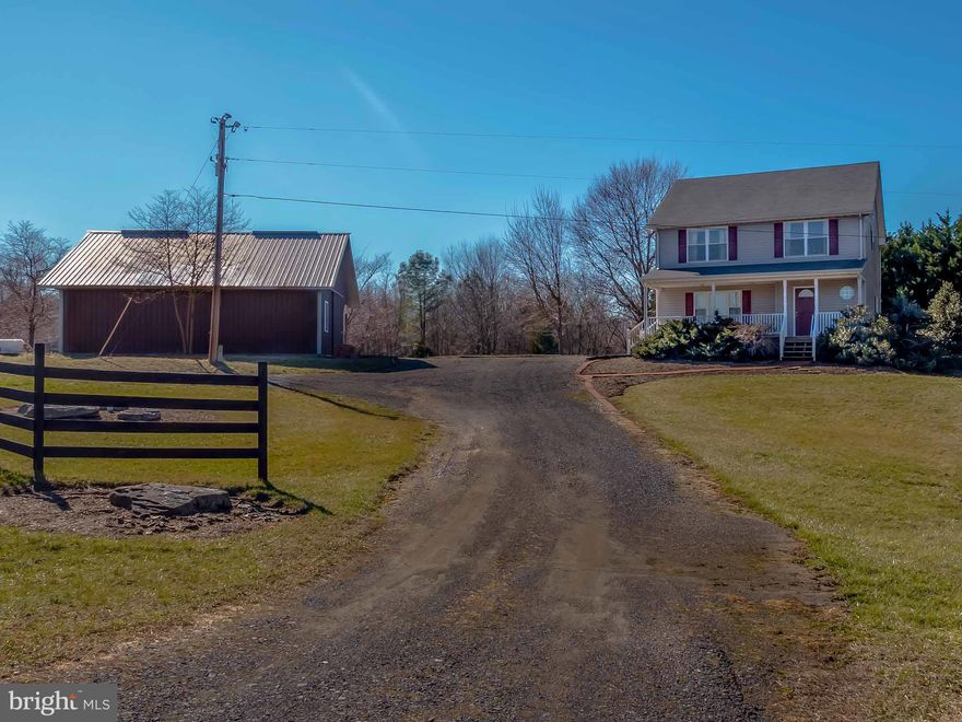 Just reduced $10,000! Bright & rebuilt 3 level Colonial on 3 acres of paradise. Kitchen w/breakfast bar, mud rm w/entrance to landscaped back lawn, open dining rm w/ sliders,separate living rm,unfinished basement. 2nd floor laundry rm, 36' by 32' steel pole barn/garage/workshop. Barn has two 10 foot tall sliding doors on either side and concrete floor. Great location off 231