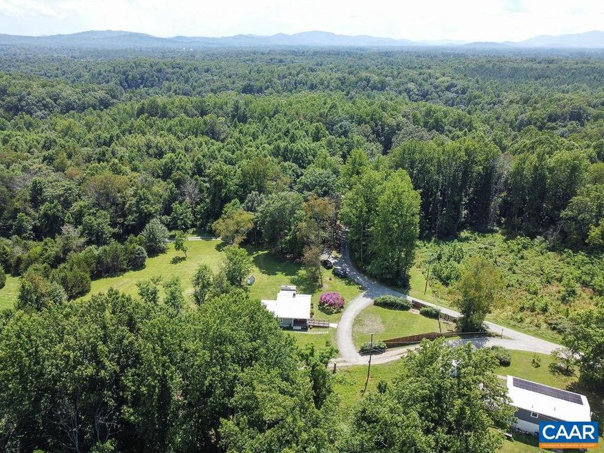This gem in Albemarle County gives all of the freedom of the country side while only 20 minutes from town. This single level, detached home near Charlottesville offers 2 bedrooms and 2 baths. Relax on the back patio and enjoy the sounds of nature. Current owners have invested over $50,000 to update and improve this home. HANDICAP ACCESSIBLE! Firefly high speed internet, New Lighting throughout house, New interior painting throughout house, Acid neutralizer, 2 New Full Bathrooms renov. in  2021, Water Mgmt. system, Renovated shed, Renovated gutters, New gravel driveway, New outdoor lighting, Updated bushes around house, Graber see through shades, Lovely neighbors, Move in ready,  Some furnishings for sale, microwave installed 2021, New Minka Aire fan, 2023,  New Fridge, 2023, Tankless water heater, All new interior lighting, House can be expanded.,Painted Cabinets