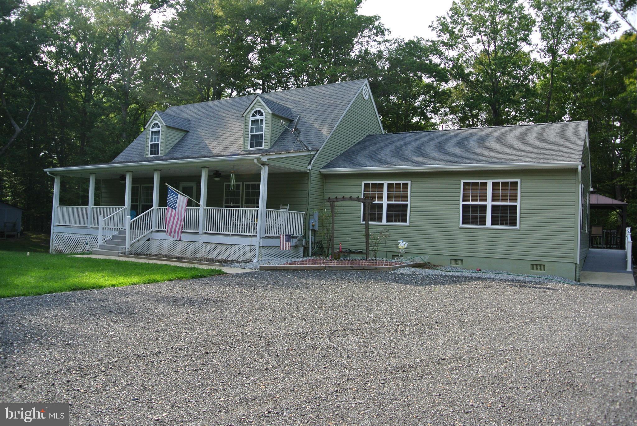 Chef's Dream Kitchen. Two Wall Ovens, HUGE Gas Cooktop, 2 Dishwashers. Lots of counter space. Massive Family room with pellet stove for those cold winter days. Composite deck overlooking large back yard with three sheds. Basement has high ceilings and lots of space. No HOA. Move in Ready. Minutes from La Plata.