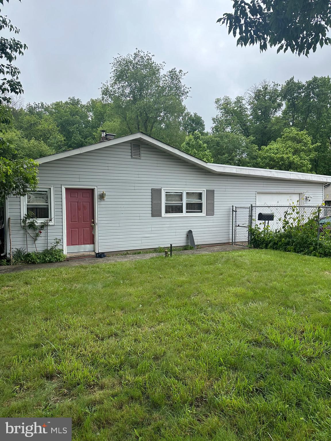 This home offers a newer roof and nice vinyl siding. Kitchen has been updated with white cabinets and there is a nice breakfast area. Full hall bath is updated and this home offers a powder room too!!! There is a huge bonus room 25x25 with newer laminate floor sliding glass doors to yard. This Room is currently being used as the 4th Bedroom, Master Bedroom but could be a fantastic family room. Separate large laundry room with newer floor. 1 car attached garage. Yard is all fenced and backs to open space! Seller needs 6/27 settlement with a rent back 6/30.