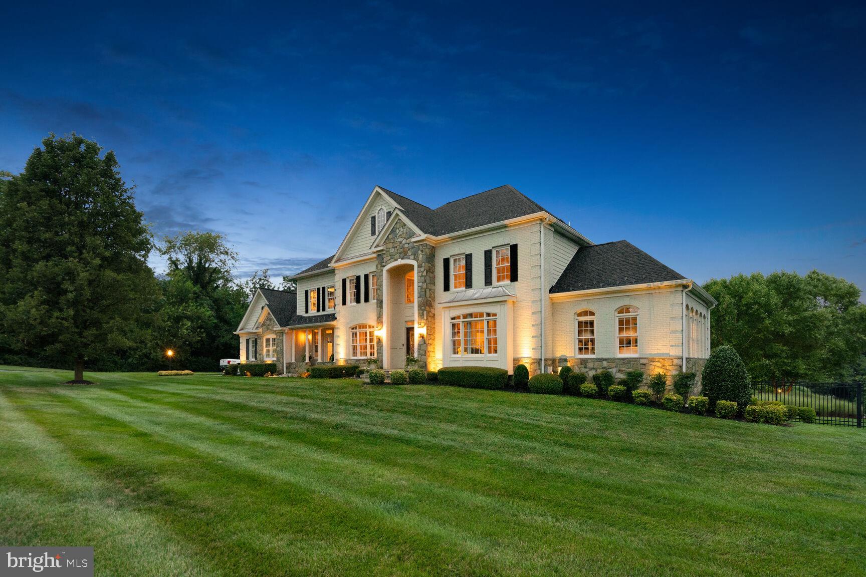Nestled in the charming town of Laytonsville, 9763 Hawkins Creamery offers an exquisite blend of luxury and comfort. This sprawling residence boasts over 8,900 square feet of living space, providing the perfect canvas for a life of grandeur and convenience. As you step through the front door, you'll be greeted by a grand foyer that sets the tone for the entire home. High ceilings and an open floor plan invite you to explore every corner of this magnificent property. The heart of this home is the gourmet kitchen, which boasts top-of-the-line appliances, upgraded countertops, and a center island, with additional wine refrigerator. It's a culinary enthusiast's dream and a gathering place for family and friends. The spacious primary suite is a true retreat, featuring a spa-like ensuite bathroom with a soaking tub and walk-in closets that will impress even the most discerning fashionista. Lower level walkout, includes a workout room, multiple large storage rooms, extra kitchen, bedroom with full bath. This home boasts multiple built-ins throughout the home including several desk areas, wet bar, designer finishes from fixtures to furniture, etc. Please note that the televisions will convey along with the window designer treatments and more. Lush, landscaped fully fenced backyard perfect for gardening and relaxation. Separate outside full bath sits privately among the pool area. As you approach the property, you'll be greeted by meticulously landscaped grounds that enhance the curb appeal and create an inviting atmosphere. Mature trees, shrubs, and colorful flowers provide a picturesque backdrop. The property features a well-designed patio area that extends your living space outdoors. It's the perfect setting for al fresco dining, lounging, or hosting summer barbecues.