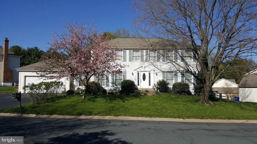 Please, come and see, and buy! This lovely colonial located in desired community features beautiful upgrades, Hardwood, laminate & ceramic floors throughout, granite in the kitchen, SS appliances, front loading washer and dryer. Spacious family room w/fireplace, bonus room on a main level,  finished basement. Great screened porch on rear, and beautiful grassy flat backyard for entertaining.