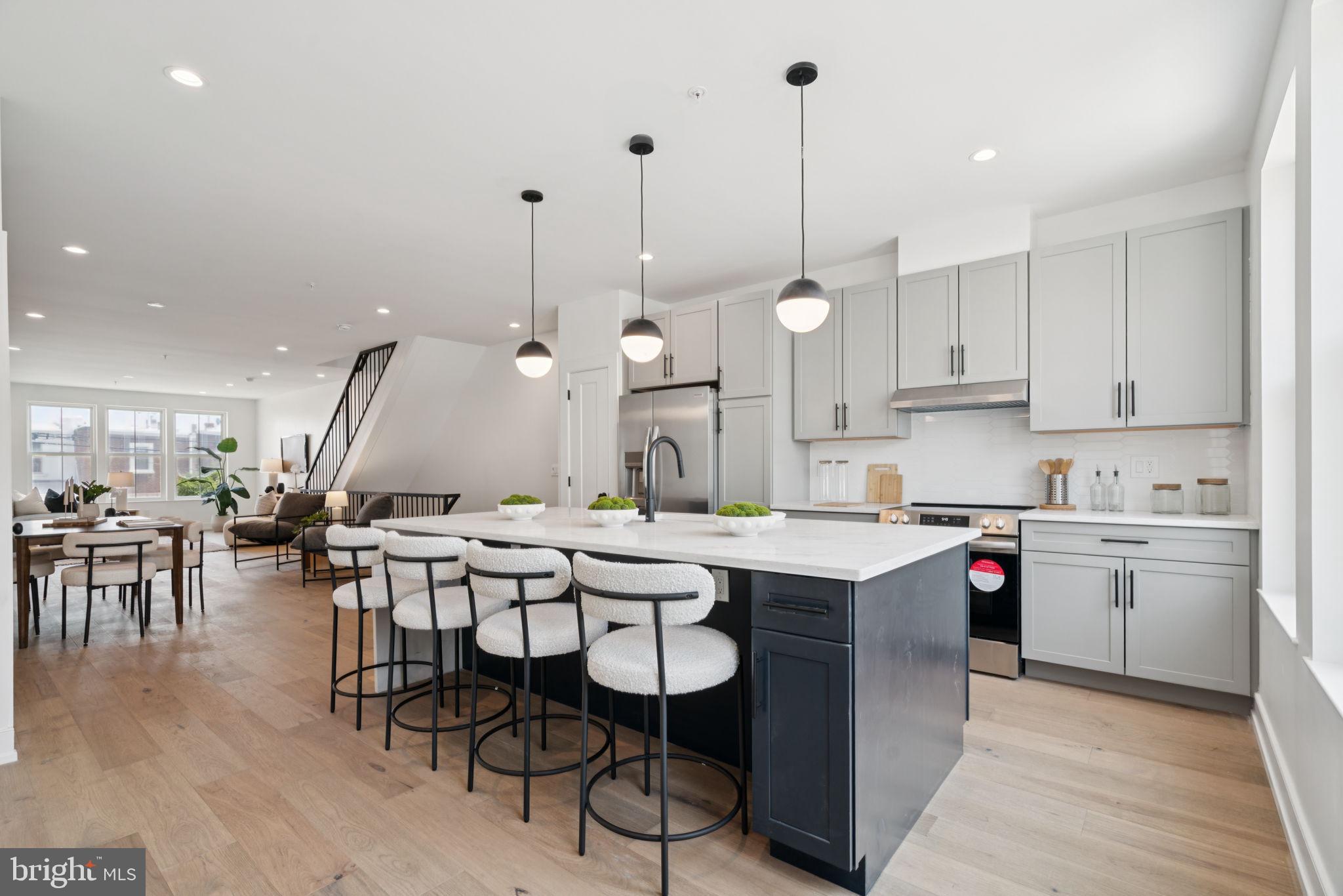 Beautiful New Construction Home located in the heart of Roxborough. This exceptional home offers over 2,700 sq. ft. of modern living space, with 3 bedrooms, 3 full baths, a 1-car garage and roof deck. Pull into your private 1-car garage, hang your coat in the closet, and walk upstairs to the massive open living room and modern kitchen with center island, ample cabinet and pantry space, stainless steel appliances and quartz countertops with waterfall edges. Window to window views and 10-ft ceiling heights create an airy, light-filled atmosphere. Upstairs you will find a luxurious master suite with walk-in closet and en suite bathroom with double vanity and wet room featuring a double shower and soaking tub. A second bedroom, hall bath, and large laundry room complement the third floor. Take the stairs to your private roof deck, and enjoy the beautifully verdant views of the surrounding neighborhood. On the ground floor level, in addition to the garage, are located your third bedroom and full bath. And don't forget to check out the cute fenced-in back yard, the perfect play area for your children or pets! Walk to bustling Ridge Avenue with its retail, restaurants and grocery stores. Just minutes from Manayunk and Chestnut Hill, close to Regional Rail for quick Center City access, and near biking and walking trails along the Schuylkill River and Wissahickon Valley Park.