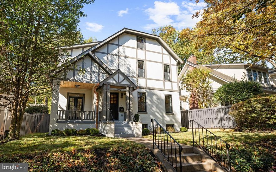 A stunning transformation by award-winning builder DILAN Homes, perfectly situated in the heart of Observatory Circle. This stately Tudor has been thoughtfully and completely reimagined for modern living while honoring its classic architectural roots. Behind the storybook façade, a luminous interior unfolds with exceptional craftsmanship, rich hardwood floors, tall ceilings, and finely detailed millwork throughout.

The main level is anchored by a beautifully appointed gourmet kitchen featuring bespoke cabinetry, marble countertops, and professional-grade Viking appliances. Designed for both everyday living and effortless entertaining, the kitchen flows seamlessly into open dining and family spaces, all enhanced by abundant natural light from newly installed oversized windows. Multiple gathering areas create a sense of ease, flexibility, and connection throughout the home.

The second level offers three generously proportioned bedrooms and three luxurious baths, including a tranquil primary suite with a spa-inspired marble bathroom, walk-in closet, and custom built-ins. The third floor provides a versatile additional bedroom or ideal home office, complete with a full bath and peaceful treetop views.

The fully finished lower level continues the home’s refined aesthetic, featuring exceptional ceiling height, a built-in mudroom area, a media or recreation space, and a private guest suite with a full bath—perfect for visitors, extended stays, or an au pair.

Outside, a spacious landscaped rear yard offers a quiet retreat for outdoor living and entertaining. A detached two-car garage, discreetly accessed from the rear alley, completes the property.

Blending timeless Tudor character with contemporary sophistication, this residence reflects the very best of Washington architecture and craftsmanship. Set on a quiet, tree-lined block moments from Massachusetts Avenue and Embassy Row, it offers refined living in one of the city’s most coveted neighborhoods.