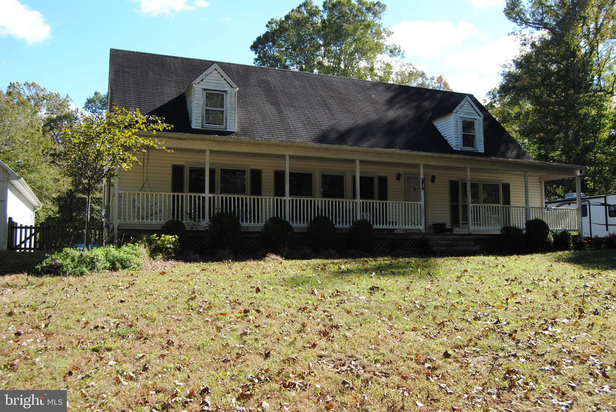 Beautiful Cape Code. New Carpet and Paint throughout. 4th bedroom added as well. Huge detached Amish built garage with upper storage area.