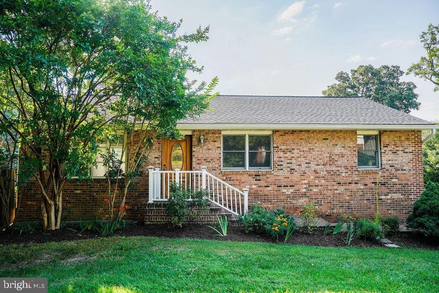 Unique Water-Privileged Community Opportunity!

Welcome to this charming home on a spacious corner lot of just under a quarter acre, featuring a fully fenced side and backyard for ultimate privacy and outdoor enjoyment. The sun-drenched deck off the kitchen is perfect for dining and relaxation.

The striking brick facade sets a distinctive tone for the character within. Inside, the open-concept living room flows seamlessly into a beautifully remodeled kitchen, showcasing new appliances and a versatile wooden workspace that doubles as a breakfast bar.

This four-bedroom home includes a primary bedroom and two full bathrooms on the main level, along with an additional bedroom and full bathroom downstairs, offering flexible living arrangements. The fully finished basement, accessible via stairs from the kitchen, opens into a spacious living area with endless possibilities. An extra bedroom, expansive family room, and potential kitchenette area enhance its functionality.

The oversized driveway provides ample parking—a rare find in this area. Enjoy exclusive access to a Chesapeake Bay-facing beach, playgrounds, a fishing pier, an additional beach along Lake Claire, and a kayak/canoe put-in along the Little Magothy River—offering an extraordinary waterfront lifestyle.

Residents also benefit from a community shopping center, volunteer fire department, and fields/basketball courts, creating a vibrant, self-sustaining neighborhood that makes the Cape one of Annapolis' most coveted locations.  *The shed and deck are as-is.*