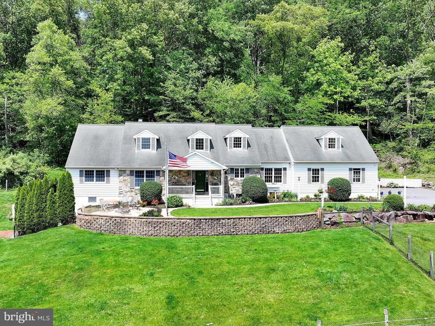 Welcome to an equestrian paradise where country charm meets comfort and convenience.  Nestled on over 30 serene acres, this exceptional horse farm features a beautifully crafted cape cod -style home boasting over 3426 square feet of living space. The spacious home offers timeless architecture  and a panoramic view of the surrounding countryside.  The walk out basement is also roughed in for another full bath. The home also comes equipped with a generator.  Step outside to discover a  , six stall horse barn with both upper and lower levels, a dedicated tac room, a workshop, 4 - 12 ft high bays, a working aisle and  horse wash.  Due to the large size of the stalls they could easily be divided into two each.  Total barn square footage 9,375!   An inground pool offers a relaxing retreat after a day on the trails .  Whether you are riding , relaxing or simply taking in the natural beauty, this property is a true sanctuary for both horses and humans.