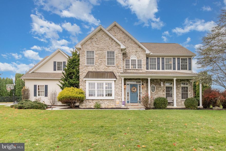 Welcome to 21 Saratoga Run, nestled in the highly desirable Olde Stone Way neighborhood within the Palmyra Area School District. This exceptional home offers nearly 3,400 square feet of beautifully finished living space, combining elegance, comfort, and functionality.

A dramatic two-story foyer with a turned staircase leads to the open main level featuring hardwood floors and detailed moldings. The two-story family room is the heart of the home, showcasing a stunning floor-to-ceiling stone gas fireplace that adds warmth and character. The custom kitchen includes Seifert cabinetry, quartz countertops, a center island, double ovens, and a sunny bay-window breakfast area—perfect for casual dining or morning coffee.

Upstairs, the spacious primary suite offers a relaxing retreat with a bay-window bump-out, large walk-in closet, and a luxury bath featuring dual sinks, a soaking tub, and a separate shower.

The finished lower level expands your living and entertaining options, with a built-in bar area complete with wine storage, mini-fridge, and microwave, a fitness room with glass doors, and a media or recreation space with surround sound—most equipment remains!

Step outside to enjoy your private fenced backyard oasis featuring a covered rear porch, gazebo, and plenty of space to relax or entertain. The oversized garage provides ample storage, room for hobbies, and includes an additional refrigerator for extra convenience.

For added peace of mind an America's Preferred Home Warranty will be included with an acceptable offer.

Don't miss the following inclusions to convey:
Dining Room Set including Buffet and Rug
2 Rockers and Table on front porch.