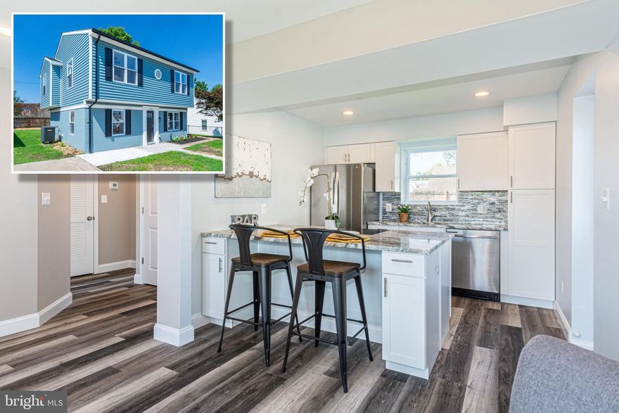 CUTTING EDGE RENOVATION WITH OVER 1,900 SQ. FT. OF LIVING SPACE!  Features include a spacious living room with wood floors, designer kitchen with granite counters & ss appliances, main level bedroom with a full bath, upper level with 3 additional bedrooms and 2 full baths with double sinks, a large rear yard, and driveway parking!  This renovation will not disappoint!