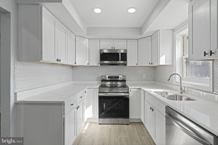 Beautifully Updated 3-Level Townhome in the Heart of Annandale! This stunning 4-bedroom, 3.5-bath townhome has been thoughtfully updated and is move-in ready! With three well-designed levels, this home boasts brand-new luxury vinyl plank (LVP) flooring, a modern kitchen with quartz countertops, stainless steel appliances, a stylish backsplash, and new cabinetry offering plenty of storage. 
The spacious main level features a bright and inviting family room, dining area, and a fully renovated kitchen, perfect for entertaining. Upstairs, the primary suite includes a large and a beautifully renovated en-suite bath, while two additional bedrooms share a fully updated hallway bathroom.
The lower level offers a fourth bedroom, a renovated full bath, a laundry area with a brand-new washer and dryer, and a recreation room—ideal for guests, a home office, or additional living space.
Step outside to enjoy the newly painted deck and fenced yard, perfect for relaxing or entertaining. Conveniently located near shopping, dining, and major commuter routes, this home is an exceptional find.
Don’t miss this opportunity—schedule your showing today.