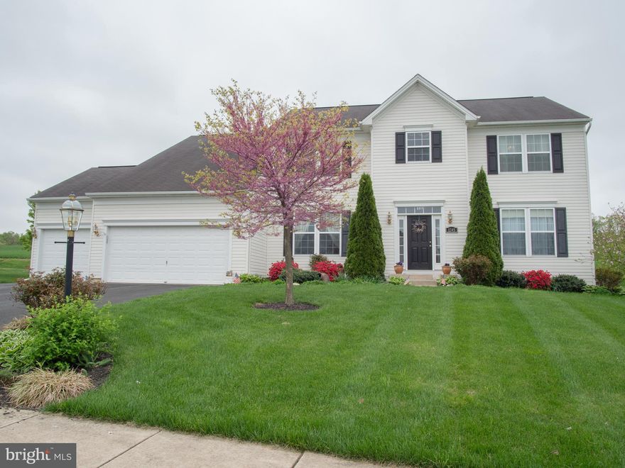 STUNNING COLONIAL WITH 5 BEDROOMS, 3 FULL BATHS, 2 HALF BATHS & 3-CAR GARAGE ON EXTRA LARGE CORNER LOT WITH MATURE LANDSCAPING.  GOURMET KITCHEN HAS UPGRADED GRANITE, TILE & GLASS BACKSPLASH, 42" SOFT-CLOSE CABINETS WITH PULL-OUT SHELVES, COOKTOP WITH POT-FILLER, DOUBLE WALL OVENS, WINE COOLER, ISLAND WITH BREAKFAST BAR & KITCHEN TABLE SPACE.  MAIN LEVEL  HAS GLEAMING BRAZILIAN CHERRY HARDWOOD FLOORS THROUGHOUT.  2-STORY FAMILY ROOM HAS GAS FIREPLACE. SUNROOM HAS CATHEDRAL CEILING THAT LEADS TO PATIO, GREAT FOR PRIVACY WITH A BEAUTIFUL VIEW OF FARMLAND.  1ST FLOOR BEDROOM/OFFICE WITH FULL BATH.  1ST FLOOR LAUNDRY WITH FRONT-LOAD WASHER & DRYER AND POWDER ROOM. UPPER LEVEL MASTER SUITE INCLUDES AN ENORMOUS BEDROOM WITH GAS FIREPLACE, WALK-IN CLOSET & LUXURY BATH WITH JETTED TUB, SEPARATE SHOWER, WATER CLOSET & 2-SINK VANITY.  2ND UPPER LEVER BEDROOM CAN BE ACCESSED FROM THE MASTER BEDROOM OR HALL.  2 ADDITIONAL BEDROOMS & FULL BATH ARE ON UPPER LEVEL.  LOWER LEVEL IS MOSTLY FINISHED WITH: LAMINATE FLOOR; HUGE L-SHAPED RECREATION ROOM; BONUS ROOM; CLOSET WITH FRENCH DOORS; RECESSED LIGHTS; 1/2 BATH; OFFICE; SLIDING GLASS DOORS LEADING TO DOUBLE-WIDE WALK-UP STAIRS TO LANDSCAPED BACK YARD; STORAGE ROOM WITH BUILT-IN SHELVING, UTILITY TUB & WORKSHOP WITH ROLLING WORKBENCH.  ADDITIONAL FEATURES INCLUDE:  300 AMP ELECTRIC SERVICE; 81 GALLON WATER HEATER; & RADON MITIGATION SYSTEM.