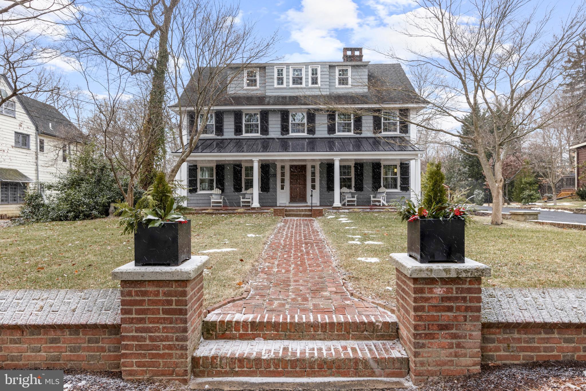 This extraordinary 5+ bedroom, 3.5-bathroom Colonial is located in the heart of downtown Swarthmore, across from the charming Umoja Park and just blocks from the town center's shops, restaurants, and SEPTA rail line. Fully renovated, this home seamlessly combines casual elegance with modern functionality. The property’s curb appeal is undeniable, with a charming brick wall framing the front and a brick walkway leading to a covered porch with a metal roof. The original solid wood door with a brass knocker invites you into this stunning home. Inside, the center hall greets you with a grand staircase and a palladium window on the landing. To the left, the spacious living room features board and batten walls, a beautiful original brick fireplace with a handsome mantel, and French doors that lead to the family room. To the right of the foyer, the dining room boasts beautiful modern sconces, another beautiful fireplace with dentil molding and raised paneling with a stained glass window leading into the kitchen. The thoughtfully redesigned kitchen combines style with practicality. It features a bar area with leathered granite counters, custom cabinetry, and a stainless steel bar sink. On the opposite wall, you'll find a KitchenAid wall oven and microwave unit, a pantry cabinet with pull-out drawers, and additional custom cabinetry, including one above the oven for cookie sheets and roasting pans. No detail has been overlooked. The kitchen also features a magnetic induction range, an oversized stainless steel farmhouse sink, a stainless steel dishwasher, and glass-front cabinetry. The artisan-style ceramic backsplash adds unique character, while the skylight and windows on two sides flood the space with light. A glass-pane door leads to the back deck, and the adjacent mudroom includes built-in cubbies for coats, backpacks, and sports gear, keeping clutter out of sight. The adjacent powder room has a Tambour fluted accent wall and other tasteful finishes. The family room is expansive, with exposed beams, built-into the beams LED lighting, and French doors leading to the fabulous deck and side patio which connects to the front porch. The oversized stone fireplace with handmade brick hearth adds tremendous character, and built-in cabinetry and beverage fridge adds to the modern aesthetic.
The second story features a large landing with arched walls and includes a beautifully appointed hall bathroom. This bathroom provides direct access to one of the bedrooms and includes a built-in linen closet. There is another additional large bedroom with organizational closet systems, and a smaller bedroom that would make a fantastic office (not included in the bedroom count). The laundry room with a utility sink and a stunning primary bedroom suite complete this floor. The primary suite boasts three walls of windows, its own HVAC split-system, a large walk-in closet, and a luxurious en suite bathroom with a tiled wall, double vanities, oversized stall shower with glass door, radiant heating and numerous thoughtful details. The staircase leading to the third floor is equally grand, with a full bathroom at the top featuring a beautifully tiled stall shower and glass door. The third floor also includes two additional bedrooms with ample closet space and a massive second family room with three walls of windows, providing plenty of light and space for relaxation or recreation. Outside there is a wonderful level backyard adjacent to the large deck and a 2-car detached garage with spiral staircase and electricity for a myriad of uses! This home is the epitome of modern living while preserving the charm and character of its historical roots. And, it's location is unparalleled - the best of suburban living with Swarthmore College nearby, the charming downtown just a few blocks away including access to Philly via the nearby SEPTA station! Don’t miss this opportunity to own a piece of Swarthmore’s history, meticulously renovated for today’s lifestyle.