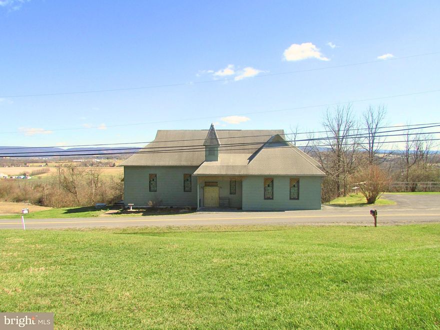 Perched above Bellefonte with commanding views of the surrounding valley, 1070 Valley View Road offers a rare blend of architectural character and modern functionality. Originally built in1905 as a church, this thoughtfully converted structure now serves as a 2-bedroom, 2-bath residence with 3,488 square feet of livable space, Set on .28 acres, the elevated location provides a constant visual connection to the landscape below changing with the seasons, beautiful sunsets and bringing a sense of openness and perspective to everyday life. The property’s vantage point enhances privacy while still remaining connected to the Bellefonte community. The fully finished main level expands the home’s versatility and comfort. This level includes two bedrooms, one full bathroom, laundry facilities, and additional finished living space, providing privacy and separation from the main lower-level area. It functions well for daily living, guest accommodations, or multi-use needs while maintaining a cohesive flow throughout the home. The home’s lower level is defined by its generous scale and adaptability. This open, light-filled space supports a variety of lifestyles and uses, whether envisioned as a serene yoga or wellness studio, a dance or creative studio, an event or gathering space, or simply an extraordinary living area that departs from conventional residential layouts. Also, have a full bath. Modern systems and upgrades have been completed with care, ensuring the home supports expectations while preserving its unique character. 2020 updates included bedrooms and closet improvements, electrical upgrades, hard wired smoke detectors, an escape window, full bathrooms on both levels, a comprehensive plumbing update with shutoffs for the kitchen, a UV water sanitation system, a water softener, a fresh interior paint scheme, installation of a power venter for the furnace, and all new doors and locks throughout the home. Between 2021 and 2022, Additional improvements included a new outdoor water spigot, a new hot water heater, mini-split heating and cooling systems installed upstairs, and added attic insulation for improved efficiency. In 2025, further enhancements were completed, including newly installed flooring in the main upstairs room, resurfacing and sealing of the basement concrete with new flooring added, and the addition of a patio with fireplace creating a welcoming outdoor space for relaxation or small gatherings. Also, included is one parking space. For buyers seeking a residence that offers more than square footage, one that delivers presence, flexibility, and a distinctive lifestyle, this Bellefonte property stands apart. It is a place where history and modern living intersect, offering room to live, create, host, and unwind all framed by sweeping valley views. Welcome to your new home.  Photos are virtually staged.