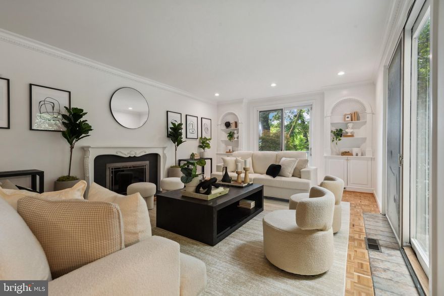Modern sophistication meets tranquil living in this fully renovated four bedroom, three full and one half bath townhome, quietly nestled in the heart of the revitalized Village of Cross Keys.  With sun drenched interiors, soaring ceilings, and a seamless blend of classic and contemporary finishes, this home offers refined comfort in a coveted private setting. Refinished parquet and hardwood floors flow throughout, complemented by high end designer lighting and thoughtfully curated details at every turn.  The open concept main level features custom built-ins, a formal dining area, and a stylish home office, perfect for today’s lifestyle. The sleek, state of the art kitchen is outfitted with stainless steel appliances, quartz countertops, generous storage, and a spacious breakfast area with adjacent laundry. Glass sliders lead to a private, fenced front patio, ideal for morning coffee or al fresco dinners in a garden like setting.  Upstairs, four well appointed bedrooms and three fully renovated baths offer space and flexibility, including a tranquil primary suite with a spa inspired feel. Every space has been designed to balance beauty and function.  Backing to a peaceful, tree lined view, the home feels like a personal retreat, yet just steps away are the community’s premier amenities: multiple swimming pools, tennis and pickleball courts, wooded walking paths, and a dynamic clubhouse with events throughout the year.  Set within a gated, beautifully landscaped community, and now surrounded by the exciting new shops and restaurants of the all new Cross Keys, this townhome offers rare access to both serenity and style.  Private, polished, and perfectly positioned, this is elevated living at Cross Keys.