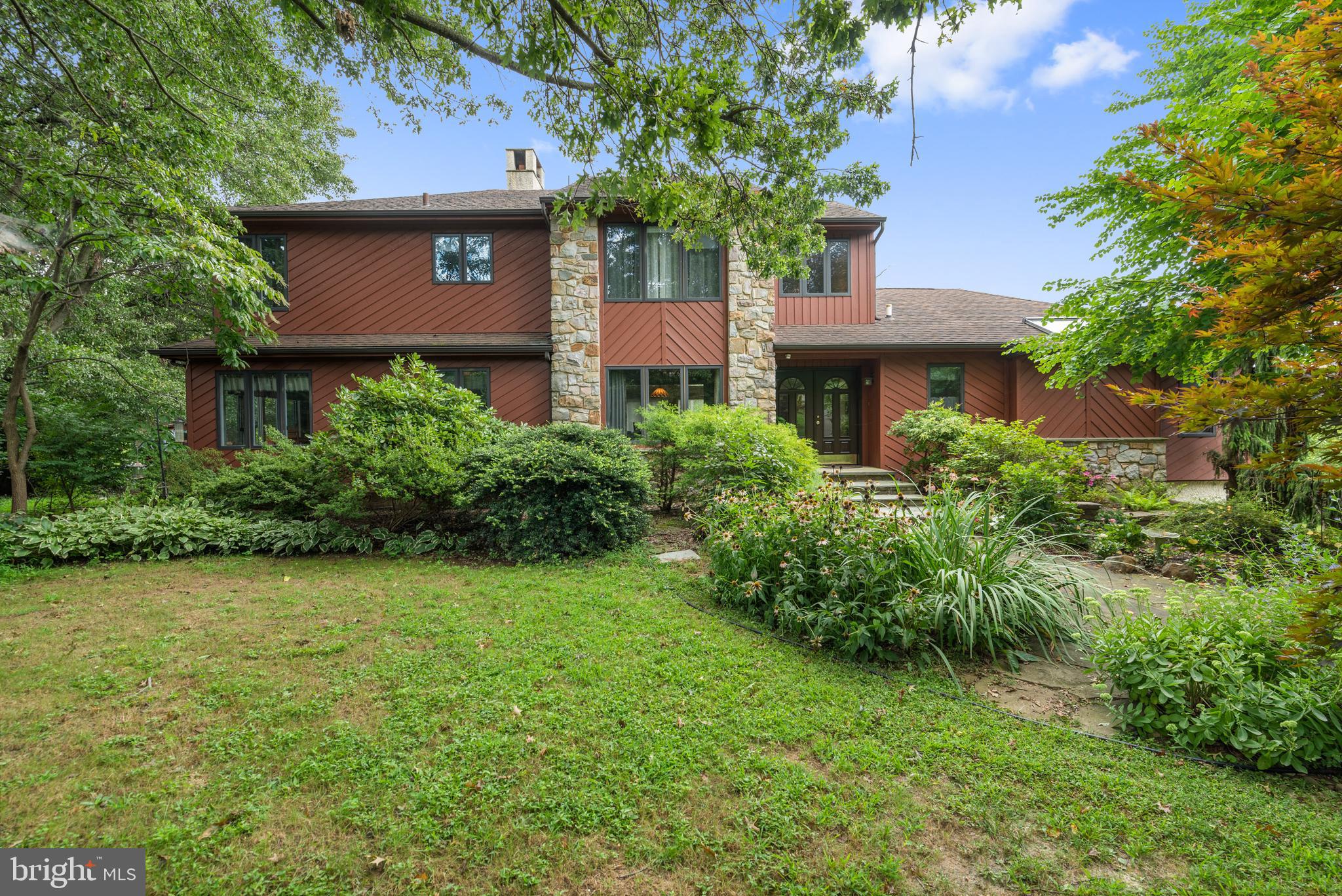 The correct address is 198 Schoolhouse Lane NOT 5 Schoolhouse Lane. The address appears incorrectly on Zillow! Welcome to 198 Schoolhouse Lane in Glen Mills, PA an absolutely hidden gem. Situated on 1.28 private acres this 5 bedroom 2.5 bathroom home is a must see. As you make your way down the private drive you'll see that this is no cookie cutter residence. Walking to the front door you're surrounded by mature landscaping and tasteful hardscaping. When you open the front door you'll instantly know that this home is special. Gleaming hardwood floors, incredible knotty pine ceiling, massive stone hearth and a wall of windows with views to die for are all right in front of you. As you tour this first floor you will find all that you're looking for. There is a formal dining room off of the kitchen that's big enough for family gatherings. The kitchen flows nicely to an eat in area that opens back to the great room. Also on this floor you will find a generously sized master suite that has a deck overlooking your new backyard! As you make your way to the second level you will find a large landing that is currently set up as an office space. The level has 3 large bedrooms and a full hall bath. Continuing your tour to the lower level you will find a 5th bedroom and a family room with a walkout to a large patio that has room for a hot tub. As you tour the exterior of the home you'll see where that wall of windows led from the first floor. The deck off of the back of the home is HUGE! This is perfect for entertaining or just enjoying your morning coffee surrounded by nature. As you continue, you'll discover raised garden beds, a horse pasture (not part of the property) and your very own chicken coop! All of this privacy and super close to major commuter routes to Philadelphia, Wilmington, Delaware and King of Prussia. There are excellent parks with paved walking trails, playgrounds and activity fields just minutes away. Residents enjoy the award winning Garnet Valley School District.