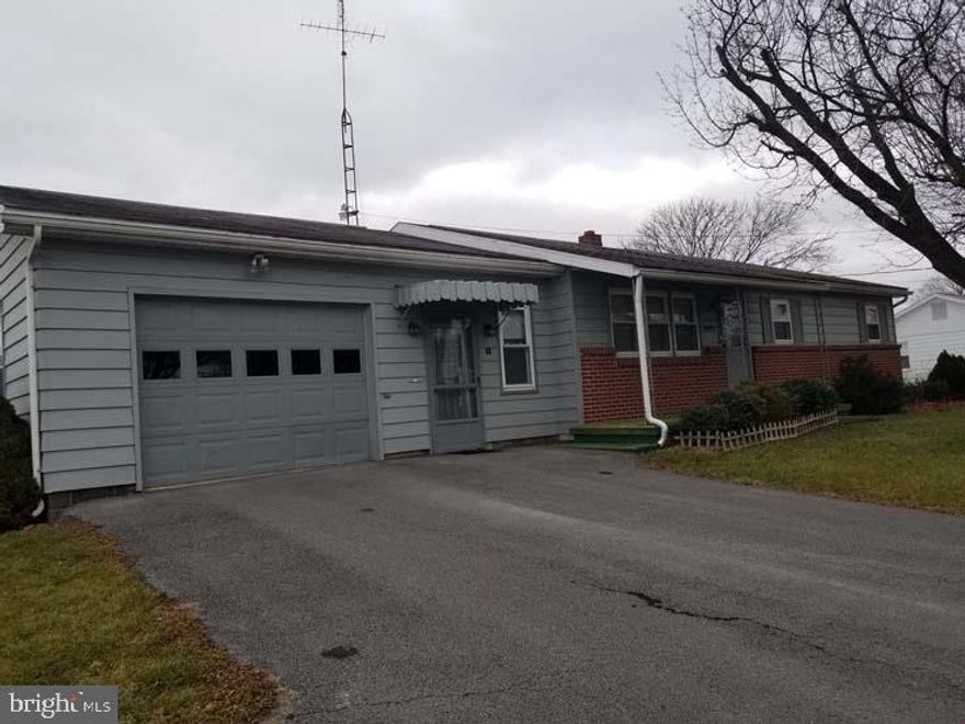 Great location for those looking to downsize or starting out! Property includes 3 bedrooms, 1  baths, carpet w/ hardwood floors, office, attic & full basement. Rear & front covered porches, replacement windows, asphalt driveway. Sited on .49 acre. Priced to sell! Call for your personal tour!