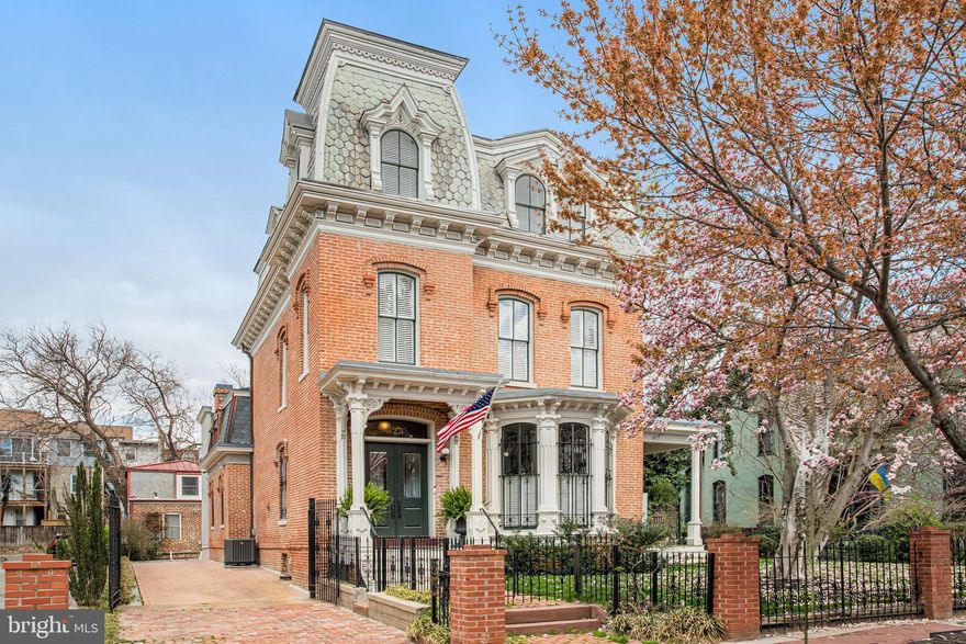 Spectacular one-of-a-kind residence with $6,000 monthly income from two legal rental units in separate carriage house. This stunning Second Empire-style home, designed by renowned architect James McGill, once served as a vibrant retreat for Howard Theater performers. Spectacular original details are throughout the main house including original crown moldings, plaster medallions, and restored wood windows. This is an entertainer’s paradise with gracious living and dining rooms. The gourmet eat-in kitchen opens to the cozy family room with the second gas fireplace. The second-floor primary suite has a spa-like en-suite bath, charming office/home gym, and enormous walk-in closet. There is also a second-floor laundry room and a one-bedroom in-law suite, accessible from the second floor hallway or direct outside access. The third floor is comprised of a guest suite with a substantial sitting room. The unfinished basement offers tons of storage and plenty of space for a workroom. Solar panels on the roof provide FREE electricity and the multi-zone heat and Central A/C are efficient while keeping every area comfortable. Only two blocks to the Green/Yellow Lines for easy access to the entire city. Five parking spaces in rear (two are currently rented), with an electric vehicle charger, complete this perfect picture. NOTE: The two legal rental apartments (2BR/1BA and 1BR/Den/1.5BA) are NOT INCLUDED in the room counts. The total rental income is $6,000/month, which will cover almost a one third of a mortgage (with 20% down). With its rich past, exquisite architectural details, and thoughtful updates, 525 T Street NW is a rare gem in the heart of Ledroit Park. Don’t miss the opportunity to own this historic masterpiece.