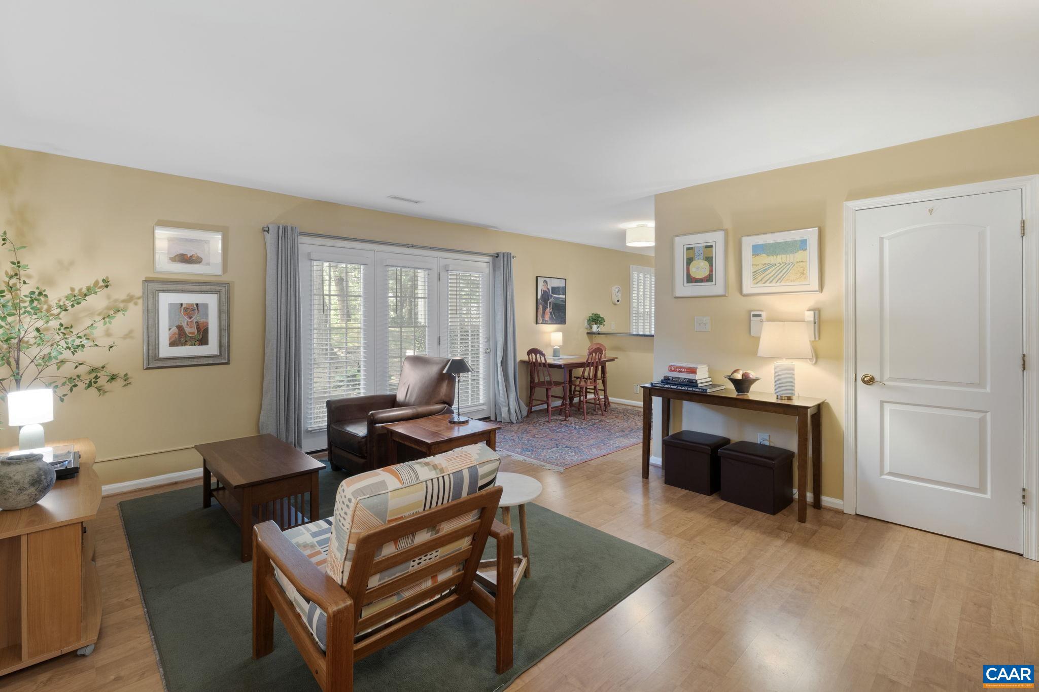 Welcome to this well-maintained 1st floor condo with 3 bedrooms, 2 full bathrooms, a spacious living and dining room as well as a den - perfect for an office, library or hobby room. This cozy home offers an easily accessible, low maintenance lifestyle with tons of amenities to take advantage of and an outdoor patio for enjoying fresh air and the view. Located just 1.5 miles to I-64, 3.6 miles to UVA Hospital, and 2 miles to Wegman's and 5th Street Station, this location can't be beat! The association dues include trash, road maintenance and snow removal, landscaping as well as the clubhouse, pool, fitness center and more! This condo is a smart choice for those seeking comfort, flexibility, and accessibility in the heart of Charlottesville. HVAC replaced in August of 2024, microwave and dishwasher replaced in August of 2023.,Formica Counter,Wood Cabinets