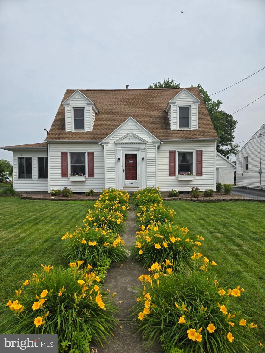 This charming four-bedroom Cape Cod offers classic character paired with thoughtful updates. Hardwood floors run throughout the home, adding warmth and timeless appeal. The first-floor primary bedroom features its own private half bath, providing convenient one-level living.  The inviting living room includes a pellet stove, offering efficient supplemental heat and cozy ambiance. Just off the side of the home, a bright sunroom with an electric stove creates the perfect space to relax year-round. Upstairs, you’ll find generously sized bedrooms, all with hardwood flooring, providing ample space and comfort. 
Additional highlights include off-street parking, a detached one-car garage, and a generous backyard ideal for outdoor enjoyment. Recent improvements include a newer roof and a new oil tank, offering peace of mind for the next owner. Ideally located within walking distance to local schools, the community playground, and downtown Elizabethtown, this well-maintained home combines comfort, convenience, and location.