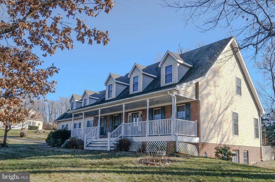 Spacious Custom 'Built Cape Cod with Master Suite on main level featuring walk-in closet, separate shower/tub and new carpet. Two story family room with 4 x27 overlook ,gas fireplace and hardwood floors. Separate dining room with hardwood floors. 3 additional bedrooms, office/den and bathroom complete the upper level.  Basement is partially finished (new carpet)including a full bath. Rear Screened Porch, 2 car garage, 8 x 38 front porch with mountain views. Great location.