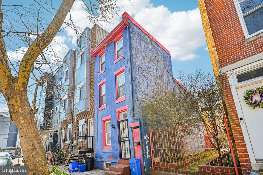 Located in the vibrant Northern Liberties/Olde Kensington neighborhood, this 2-bedroom, 1-bath home offers a unique blend of flexibility, comfort, and city convenience. A standout feature is the deeded adjacent gated lot—providing a rare opportunity for outdoor enjoyment, potential expansion, or future possibilities. Inside, wood flooring extends throughout the first and second levels, complementing the bright, open layout. The spacious living room flows seamlessly into the kitchen. From there, a rear exit leads to a private extended outdoor oasis. The second floor features a well-appointed bedroom, an updated full bath, convenient laundry, and access to a rear balcony—adding both function and outdoor space. The upper level offers an additional bedroom, providing separation and versatility for a variety of uses. A full, partially finished basement adds extra space for storage, hobbies, or additional living needs. Central air ensures year-round comfort. Situated near local shops, dining, and popular destinations such as Wissahickon Brewing Company and The Northern Liberties Piazza, this home offers convenient access to everything Northern Liberties has to offer while maintaining a comfortable residential feel. Mortgage savings may be available for buyers of this listing.