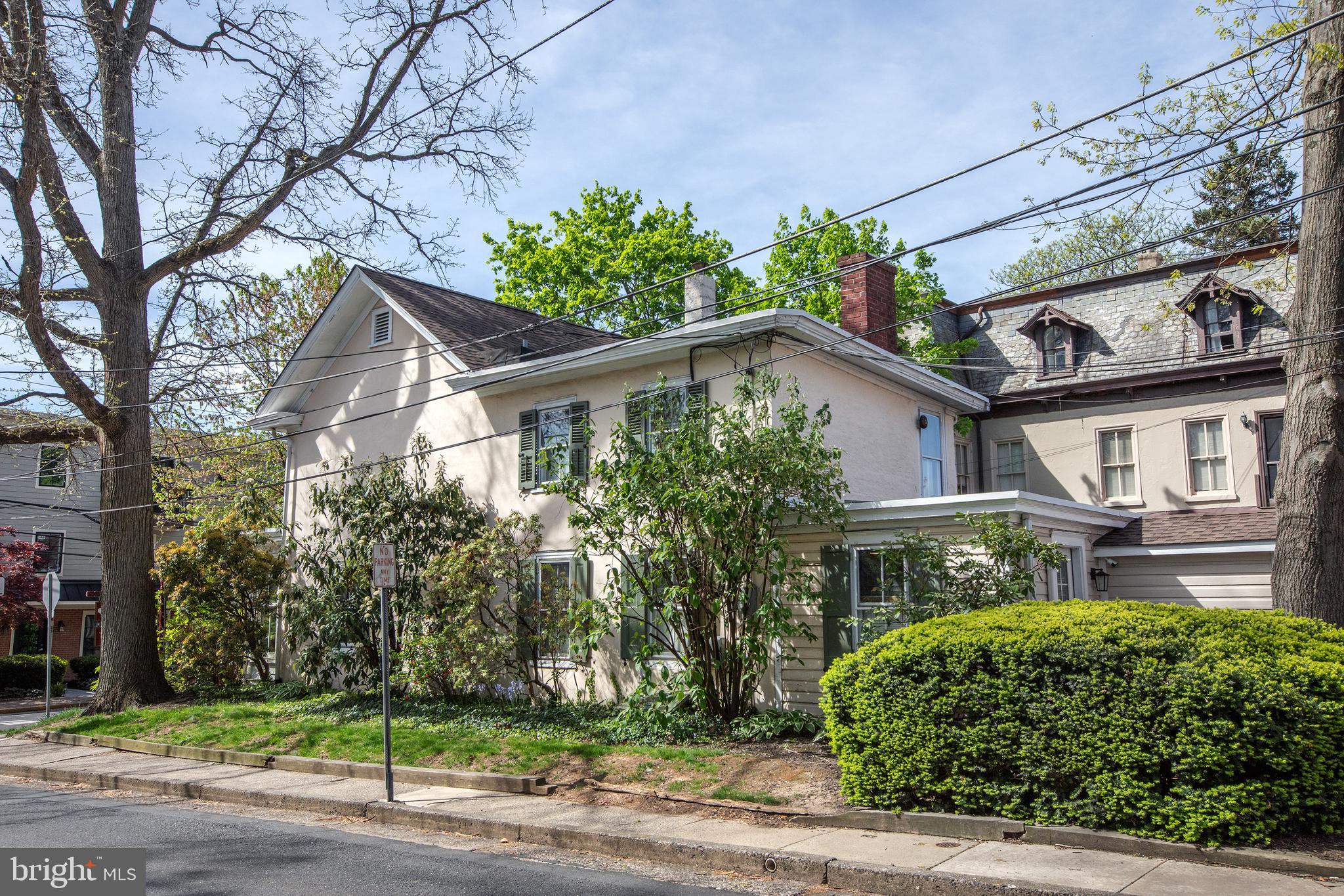 Location, Location, Location.The Edward Heston House: dating back prior to 1845, this plaster-over-stone home is listed on the National Register of Historic Places and features a charming two bedroom dwelling in combination with a business. Located in the center of downtown Doylestown, enjoy immediate access to the shopping district, County Theater, Michener Museum, and restaurant row. Perfect location to watch the bike races, and close to the Memorial Day Parade and Arts Festival. Original wide plank pine floors, deep set windows and custom built ins throughout, enter through the bright due-South facing Sunroom with oversized windows, perfect for any plant lover and a great spot to sit and people watch. The main level includes a large home office/meeting room which can double as a dining room, a formal living room and full kitchen with back entrance from the ample paved parking lot (room for easily 4-6 vehicles). The private back yard features a stone terrace area, stands of mint and blueberry and quince bushes, and an attached shed/storage structure. Looking for more space? The existing footprint could offer a great opportunity to expand the upper floors and create something customized to your liking. New roof, H/W heater, newer Central AC and minisplit, radon remediation system, partial exterior CCTV and security system ready, etc. Consult Borough Zoning online for explanation of dwelling-in-combination and other potential uses by right.