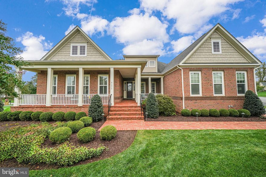 Rarely available and sought-after Northridge model, a modern version of the cape cod style home that offers main-level living with soaring 10' ceilings across the main level, soaring to 12' in the family room and in the primary bedroom with matching double-tray ceilings!  This home is the former builder model and has been loaded with extensive trim and design upgrades throughout the interior, while the original owner has invested heavily into the garage, turning it into a car-lovers dream garage with two hydraulic lifts, soaring 13.5" ceiling heights, additional lighting and more.  

As you enter, you will notice the extensive molding & hand-scraped wide plank hardwood flooring found throughout all living areas on the main and upper level.    The gourmet kitchen offers generous amounts of cabinet storage, a large center island and a morning sunroom extension, allowing a large kitchen table that is perfect for casual dining surrounded by a wall of windows.   The family room offers cozy gas fireplace, double tray ceiling with crown molding, and is open to the kitchen for seamless entertaining.    

The generously sized main-level primary bedroom offers double-tray ceiling, dual walk-in closets with incredible shelving and storage.  The ensuite primary bathroom offers a spa-like experience with separate vanities, a large garden soaking tub plus separate shower with glass enclosure.   A second and third bedroom share an additional full bath on the main level, while a separate powder room is available for all guests.

The upper level offers a cozy reading or hobby area, the fourth and fifth bedrooms and a third full bath with double-bowl vanity.   The lower level offers incredible open space for entertaining with large recreation room areas, separate space for gaming tables, home theatre viewing area, plus a full wet bar.    The lower level continues with two additional bedrooms and fourth full bath with double-bowl vanity, perfect for the au-pair or overnight guests, plus a separate home gym and large storage area!   The outdoor entertaining flows seamlessly from the kitchen into a screened in porch, and down to a paver patio.  The outdoor space is framed by thoughtful landscaping, while in-ground irrigation helps to keep it looking beautiful year-round.  

Located in the sought-after Gary Player designed Raspberry Falls Golf and Hunt Club, located 10 minutes from the center of historic downtown Leesburg with its restaurant and brewery scene, this location offers incredible convenience and sits at the gateway to western Loudoun County, with numerous award-winning breweries, wineries, parks, recreational farming venues, Potomac River access, proximity to the W&OD trail plus the C&O Canal trail that runs along the Potomac River.