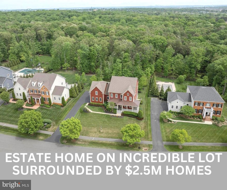 HUGE Price Reduction and now priced below comps for the highly sought after Wilburn model built by Camberley Homes  in The Grant neighborhood of Willowsford (houses on this street recently sold for $2.4-$2.5M).   Best value for your money in Willowsford and located on one of the premier cul-de-sac streets backing to acres of trees and conservancy land.  Location, location, location!  This home is in immaculate condition and waiting for you to move in.  <br><br>
Hardwood floors throughout the main level, coffered ceilings, oversized island in the chefs kitchen with stainless steel appliances, new light fixtures, open floorplan with breakfast room, three covered porches, front office or flex bedroom, four spacious bedrooms upstairs with en suite bathrooms, and a spacious basement with full bathroom await you in this immaculately maintained estate home.  <br><br>
Located in Ashburn, Virginia, the award-winning Willowsford community stands out with its unique blend of rural charm and modern amenities. Spread across acres of scenic landscapes, Willowsford boasts working farms, orchards, and community gardens, allowing residents to partake in farm-to-table experiences and embrace sustainable living. Miles of interconnected trails wind through the community. Residents can enjoy state-of-the-art clubhouses with fitness centers and swimming pools, along with a calendar full of events ranging from farmers' markets to outdoor concerts. Willowsford offers residents an unparalleled lifestyle that celebrates nature, recreation, and connection.