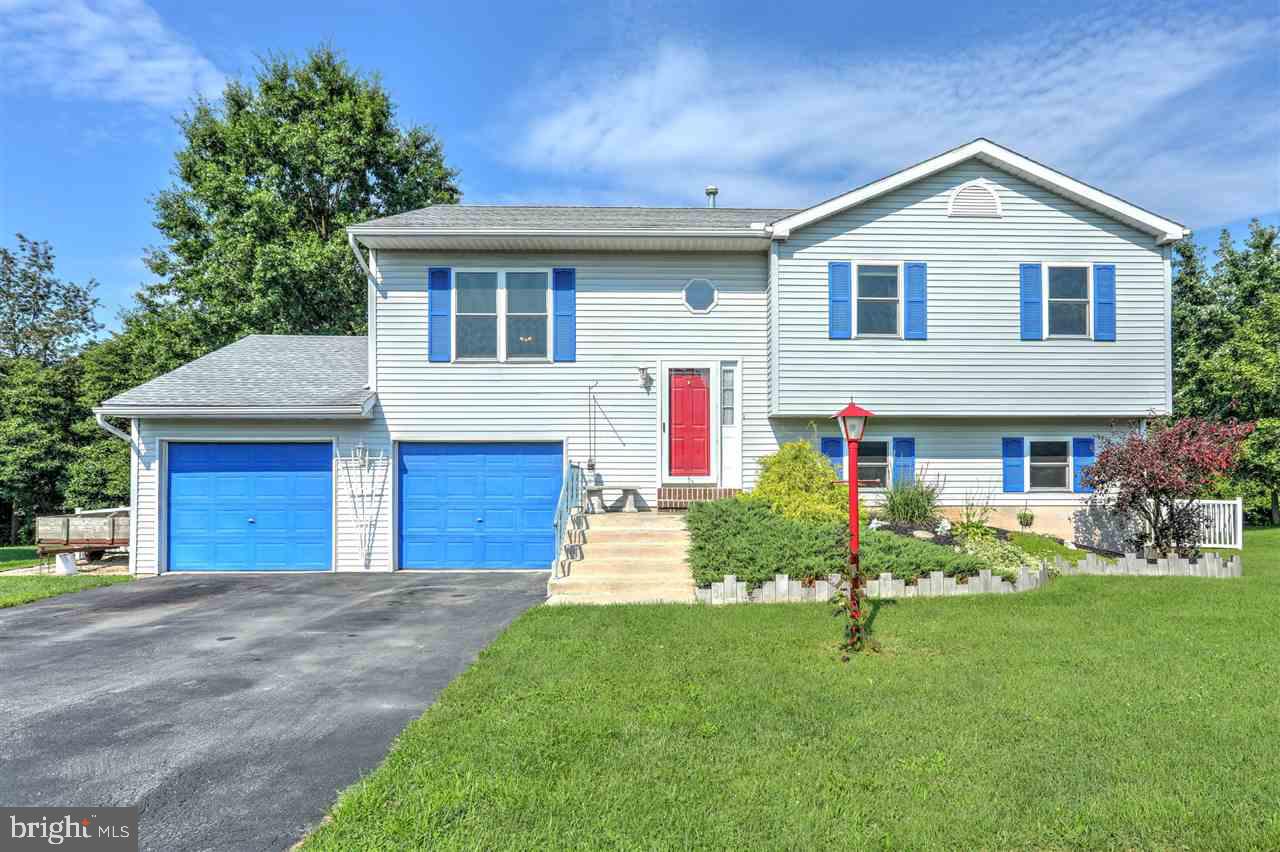 Freshly painted with new floors, this spacious home invites you to enjoy life inside and out! With a huge level & fenced backyard lined with trees, you have privacy and the perfect entertaining space! Room for everyone with 4 bedrooms, 2 full baths & family room. Extra large garage with workshop area allows space for your toys too. Newer roof, AC unit, hot water heater, windows .
