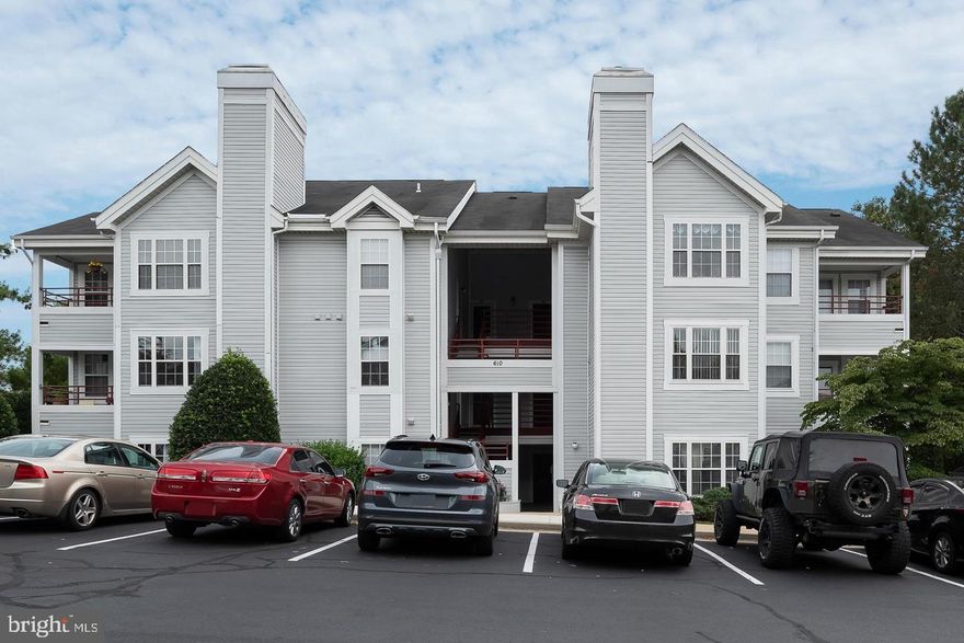 Renovated and well-maintained 1st floor condo. Freshly painted throughout. Fully updated kitchen. Both updated baths are magnificent. Master bedroom with full bath, upscale closet organizer and private sliding doors to patio. Living room with stone fireplace. A nice nook off the living room for office/den. New engineered Hardwood floors throughout 2023. Beautiful gray front-loading washer and dryer in the unit. Private patio with wooded view. Prime location near Fort Meade, Baltimore, DC and Annapolis. Easy commute. Move-in ready!