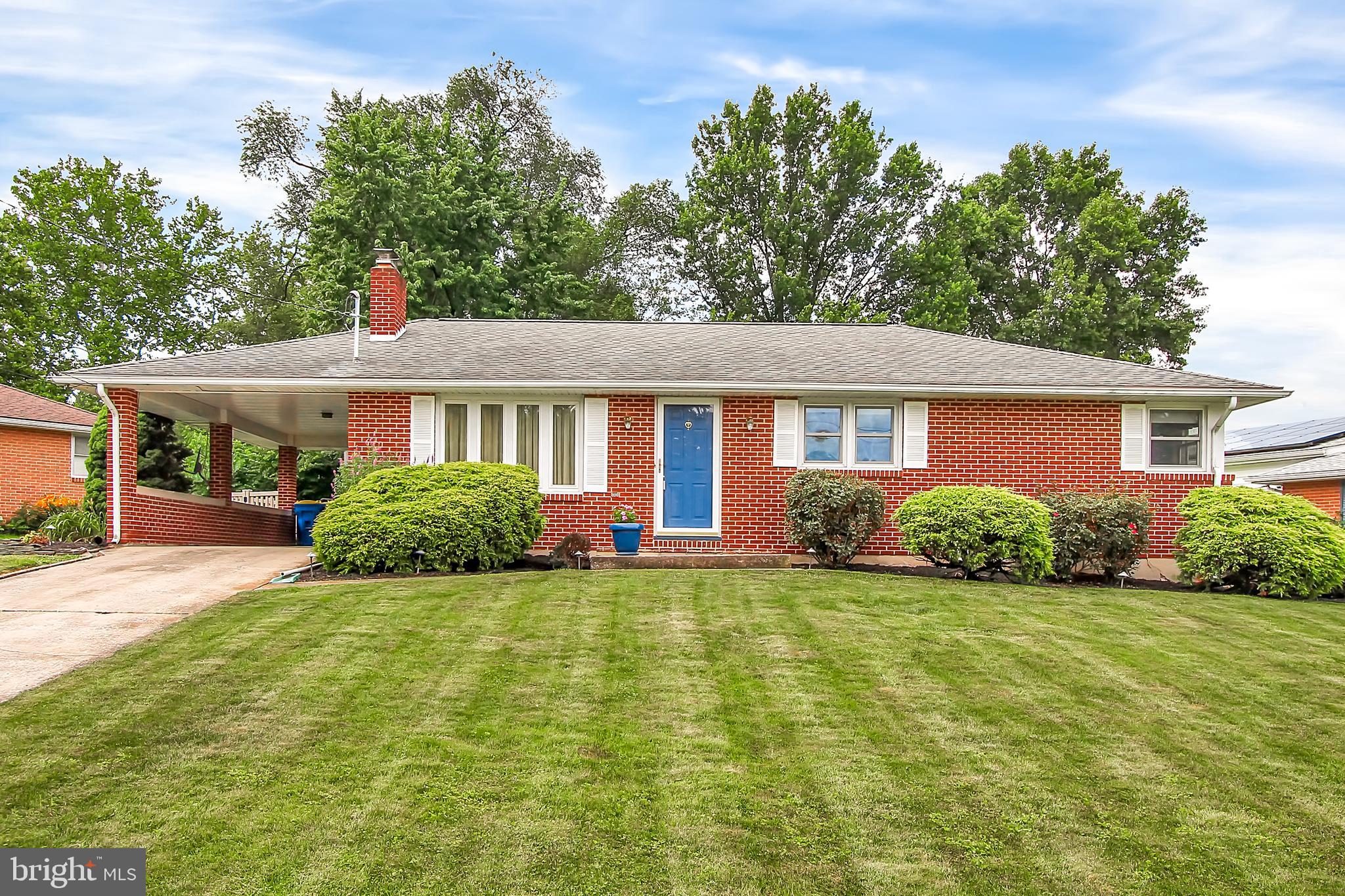 Here's a surprise! This perfect all brick ranch is so much larger than it appears. The space in the lower level will surprise you for sure. Nice corner lot in Weigelstown close to shopping and schools. Nice size rooms throughout, pretty hardwood floors on the main level. Remodeled bath with Appleby tub enclosure. Dining room over looks the covered deck and yard so you can keep an eye on the little ones. The lower level is unbelievable though. Set up for an in-law qtrs, or maybe just the twenty something that moved back home. Plenty of room to move. Pretty tiled floors & separated space for any number of uses. A big full bath with walk in shower and huge walk in closet for storage, office and even more play room space. The rear yard is fenced and it's all waiting for you to finish the Summer season