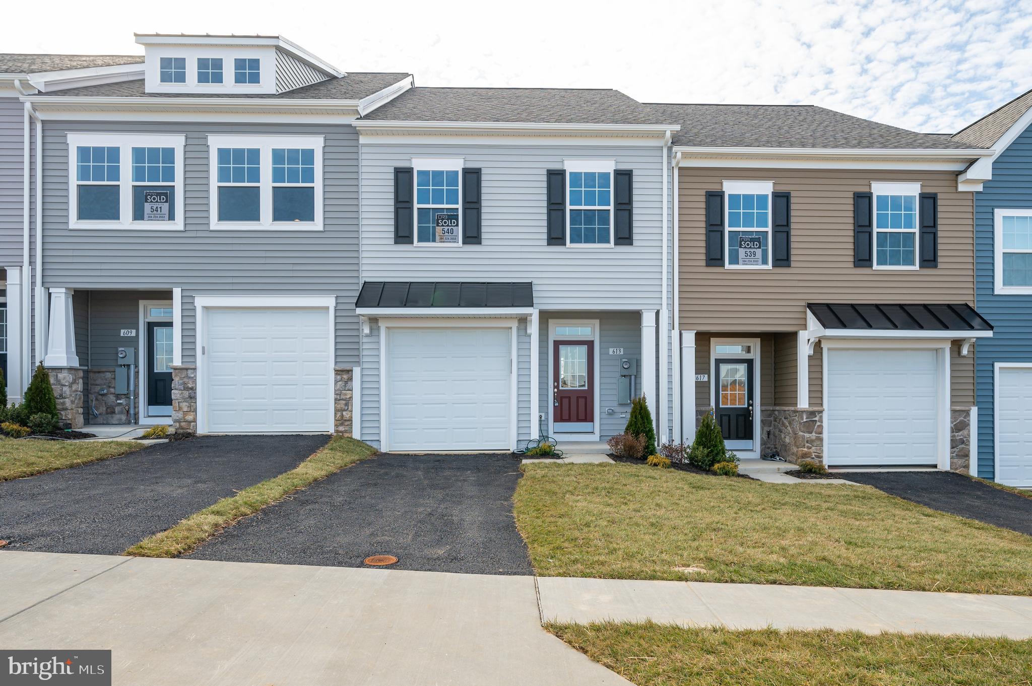 Discover luxury living in Berkeley County's premier planned community of Martinsburg Station! 613 Detroit Square is a stylish 2-level townhome featuring 3 bedrooms, 2.5 bathrooms, a covered front stoop, partial stone front, and 1-car garage. Enjoy high-end finishes like 9 ft. ceilings, a spacious kitchen with stainless appliances, white quartz countertops, and an open family room with access to a private oversized backyard patio. The primary suite boasts a large walk-in closet and private ensuite bathroom with dual vanities and a tiled shower with shower niche. Two additional secondary large bedrooms are also featured on the second level with a shared full hall bath. Laundry included and conveniently located off of the bedrooms. Enjoy community amenities like a clubhouse, pools, and walking trails with breathtaking mountain views. Embrace this opportunity for sophisticated, convenient living. Schedule a showing today and see if this is the home you've been searching for! Applicant(s) must be able to pass credit/background check. MINIMUM FICO CREDIT SCORE OF 650 REQUIRED FOR ALL ADULT APPLICANTS. No Smoking. No Pets.