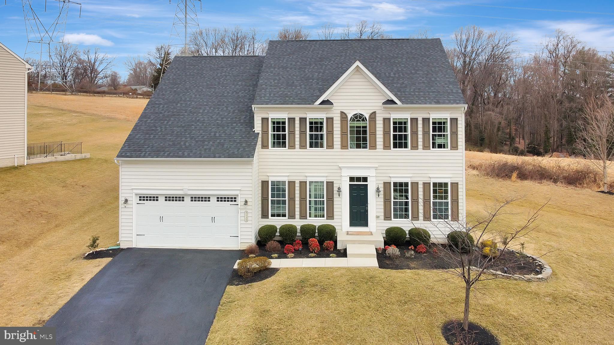 Absolutely stunning NV homes (Empress model) located in the Bonnie Branch Woods community. This well maintained home features 5 bedrooms, 4 full baths, and 1 half bath including tons of upgrades and ample sunlight throughout the house. Main level - First floor features an office room, foyer entry, and a living room, crown molding, hardwood floor throughout entire first floor, upgraded kitchen with SS appliances, granite countertops, center-island with pendant lighting, formal dining with wainscotting & additional windows overlooking community open space, pantry, family room with fireplace, 9 ft+ ceilings on 3 levels, oak stairs. The private home boasts French doors, ceiling fans, and recessed lighting. Second floor includes four generous bedrooms with multiple walk-in closets and new carpet throughout. Owners suite with remarkable tray ceiling and his/her walk-in closets. The luxurious owner's bath features double vanities, soaking tub, oversized standing shower. Jack & Jill bathroom attached to 2 bedrooms, Guest bedroom with attached bathroom, laundry room with custom cabinets, hardwood floors in the hallway. The finished basement includes a full wet bar with custom cabinet and granite counter top, full bath with standing shower, bonus room that can be converted as bedroom, kids play area, home theater with 2 zone in wall Klipsch speakers in the entire basement, custom shelves and walkup double door. Walk out from the Kitchen/Family room to a brand new 22 X 18 stone patio backing to open space for a nice family gathering. 2 car garage with an extended driveway for additional driveway parking. Additional upgrades included a fresh coat of paint and a custom finished basement. This house has tons of additional upgrades and a must-see home!