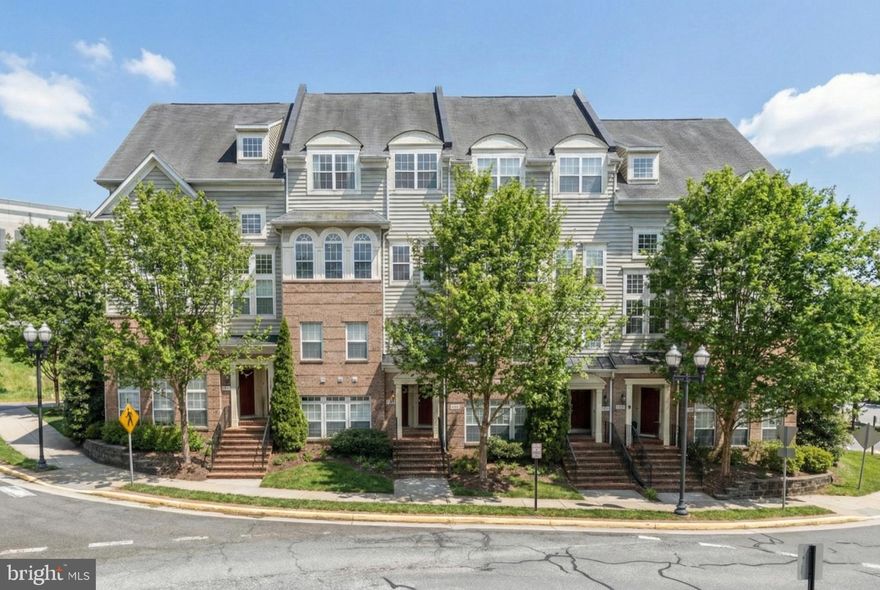 Welcome to this beautifully maintained 3-level brick and siding townhome-style condo offering over 1,700 square feet of stylish and functional living space. Enter through the rear-entry garage and continue up to the spacious main living area filled with natural light from oversized windows and transom accents, complemented by updated lighting and attractive LVP flooring. The open-concept kitchen features granite countertops, stainless steel appliances, gas cooking, and a center island with double sinks—perfect for everyday living and entertaining. French doors from both the kitchen and dining area lead to a private balcony, creating a seamless indoor-outdoor flow. This level also includes a convenient powder room and full-size laundry area.

Upstairs, the generous primary suite impresses with a tray ceiling, ceiling fan, private balcony access through French doors, a large walk-in closet, and an ensuite bath with soaking tub, separate shower, and double vanity. Two additional bedrooms and a full hall bath complete the upper level.

Ideally located within a short distance to Tyler Elementary School and just minutes from shopping, dining, and entertainment in Haymarket and Gainesville. Commuters will appreciate easy access to Tysons, Manassas, and Washington, as well as convenient proximity to I-66. This home offers the perfect blend of comfort, convenience, and location.