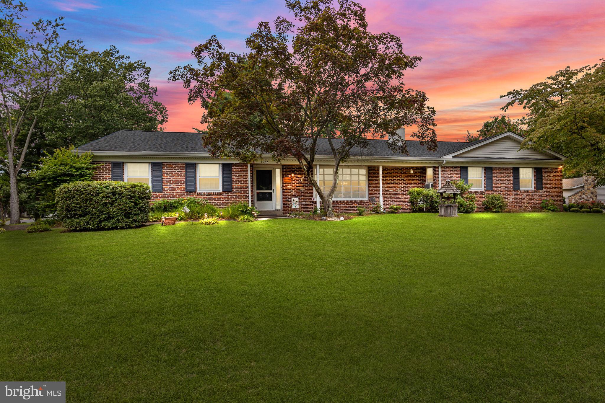 Welcome to 1286 Yale Drive, a beautifully maintained brick-front ranch located on a desirable corner lot in Yardley’s highly sought-after Sandy Run neighborhood within the Pennsbury School District. This charming home features 3-bedrooms, 2.5-bathrooms, 2-car-garage, finished basement, screened porch, fenced in yard & more giving the perfect blend of comfort & convenience. Step inside to find a spacious and inviting layout, highlighted by a bright living room with a bay window and wood burning fireplace. The well-designed eat-in kitchen has a full appliance package & ready for your personal touch. Off the Kitchen, the family room is cozy with a second wood burning fireplace, access to the screened porch and laundry room. Laundry room features washer/dryer, storage closet, wash sink and access to garage, basement, & driveway, Main floor features three generously sized bedrooms & a hallway full bathroom with bathtub. The primary bedroom has 3 closets, ceiling fan/lights & an en suite with stall shower. The finished basement adds valuable living space, ideal for hosting with an additional living room & third wood-burning fireplace, office, gym, entertainment area, possible bedroom, storage, & utility rooms. This home has been meticulously cared for with many recent updates, including a newer roof (2022), boiler (2021), hot water heater (2019), 200-amp electrical panel (2019), a whole-house generator, & shed with electric for peace of mind. The freshly seal coated driveway and attached 2-car garage adds to the property’s curb appeal and functionality. Enjoy the benefits of single-level living with the added bonus of a finished lower level, all set on a lovely corner lot in one of Yardley’s most desirable communities. Don’t miss your opportunity to own this well-maintained home in a prime location close to shopping, dining, major commuter routes, and all that Yardley has to offer.