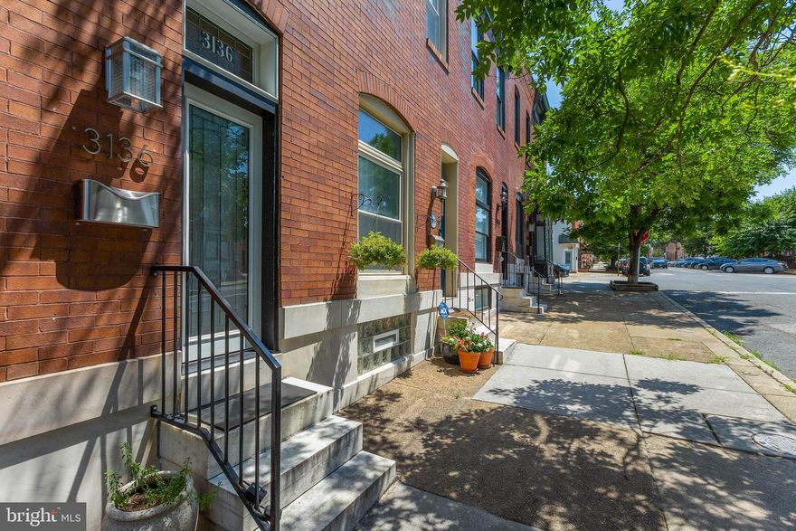 ​Cutie in Canton! This classic Baltimore rowhome has the downtown trifecta: a rooftop deck, a parking pad, and a prime location. ​If you're searching for a home brimming with original character, this is the one - you'll love the exposed brick, original hardwood floors, and fantastic natural light. The main level is open and bright, and the house was just freshly painted (one less thing for you to worry about!). The kitchen has updated stainless appliances and a gas stove. The upper level has two bedrooms and two full bathrooms - both baths are nicely updated, and one of them is particularly charming with exposed brick and a beautifully tiled shower. The back bedroom opens to a two tier deck - head up the spiral staircase where you can entertain your guests, watch lovely downtown sunsets, and enjoy stunning views for miles across the city. The finished lower level has another living room, half bath, plenty of storage, and brand new LVP flooring. Most importantly, the parking pad at the back of the property will make your life so easy and convenient!