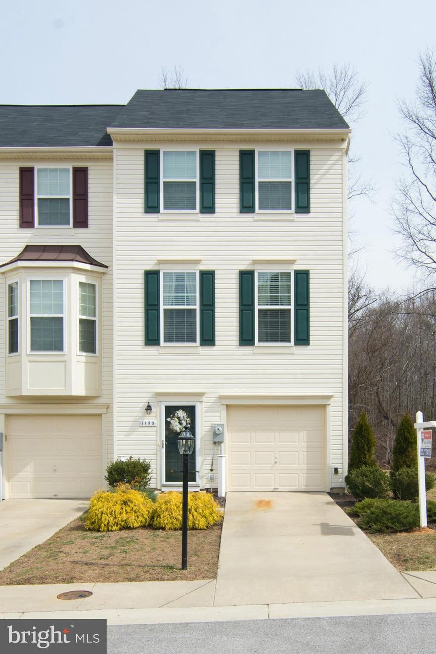 PENDING RELEASE  Better-than-new end unit in Tanyard Springs has updates throughout including a finished laundry room, granite island, crown moulding, gleaming woodlook lam flooring, custom paint, trex deck with solar post caps, and more.  Master Bedroom with walk-in, attached bath w/double vanity, spacious garage. Backs to woods and common area - best location in the neighborhood!