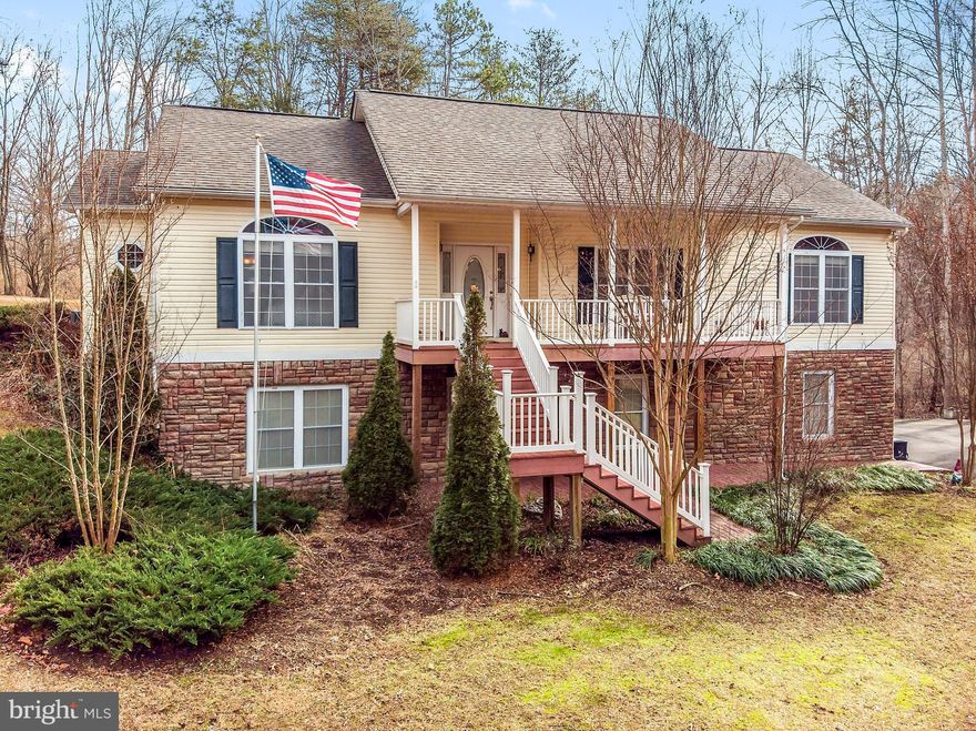 Gorgeous raised rambler with open floor plan and lots of upgrades!  Great room with gas fireplace, stainless appliances with gas cooktop, huge island, sunroom leads to deck, master bedroom with double vanity and soaking tub plus walk in closet, 2 additional BR's w/ bath, lower level - 2 rooms fin, full bath & plenty of storage.  Oversized 2 car garage, porch for relaxing, deck with awning &  shed.