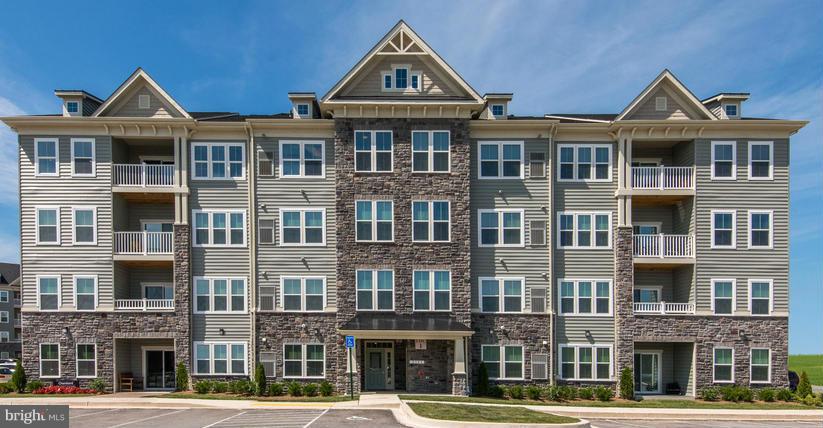 Stunning Chambord Model, (Second Floor Rear) for October Delivery in 55+ elevator condominiums! Call to schedule your appointment to take advantage of this wonderful opportunity. Upgrades in this home include: Granite in Kitchen & Baths, Upgraded tile in Baths, Painted Hazelnut Cabinetry, Upgraded Carpet & Pad. Ask about closing incentives available w/ NVRM. Images shown are representative only.